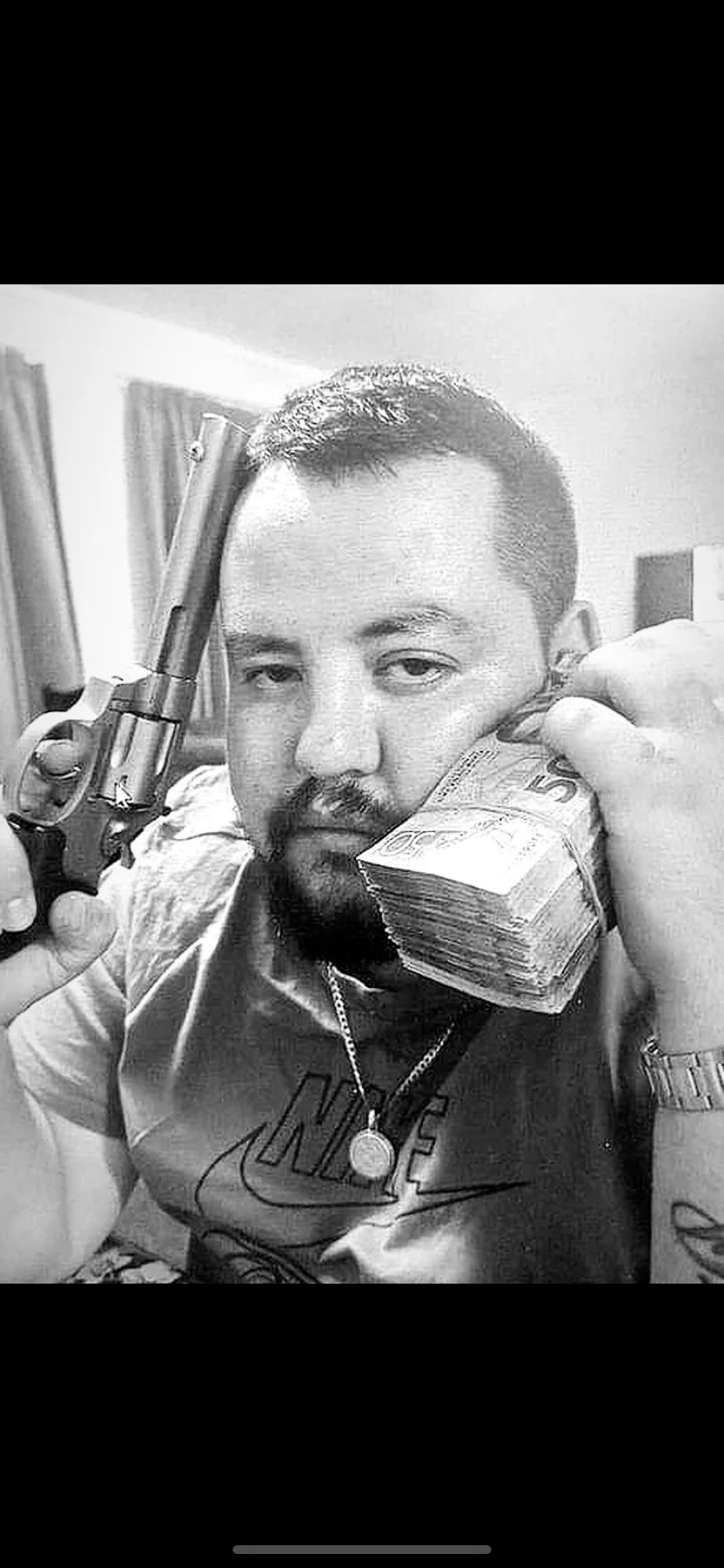 Hone Kay-Selwyn, who opened fire on Ponsonby Rd on May 5, killing Robert Sidney Horne, poses with a pistol and a wad of cash.  Photo /  Supplied