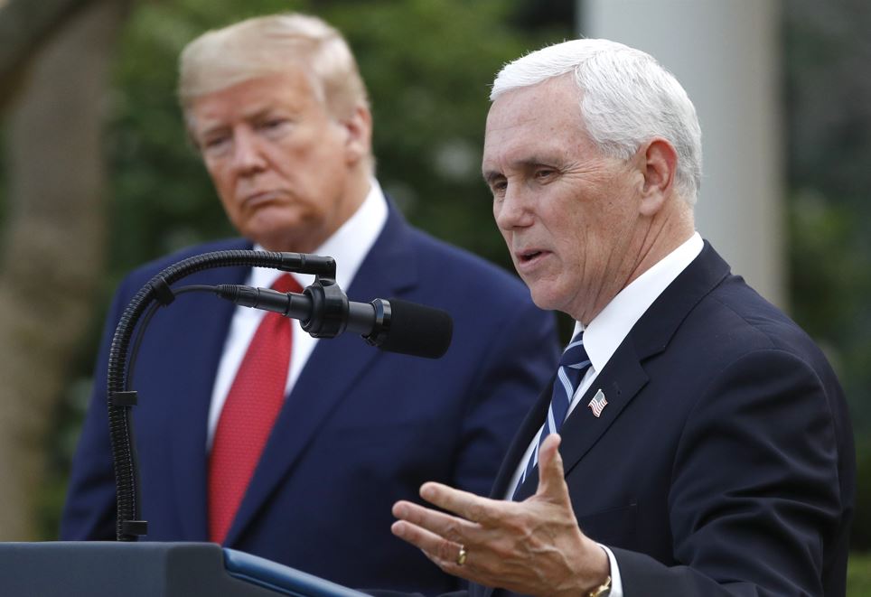 Former President Donald Trump listens as former Vice President Mike Pence speaks during a briefing at the White House. Photo / AP