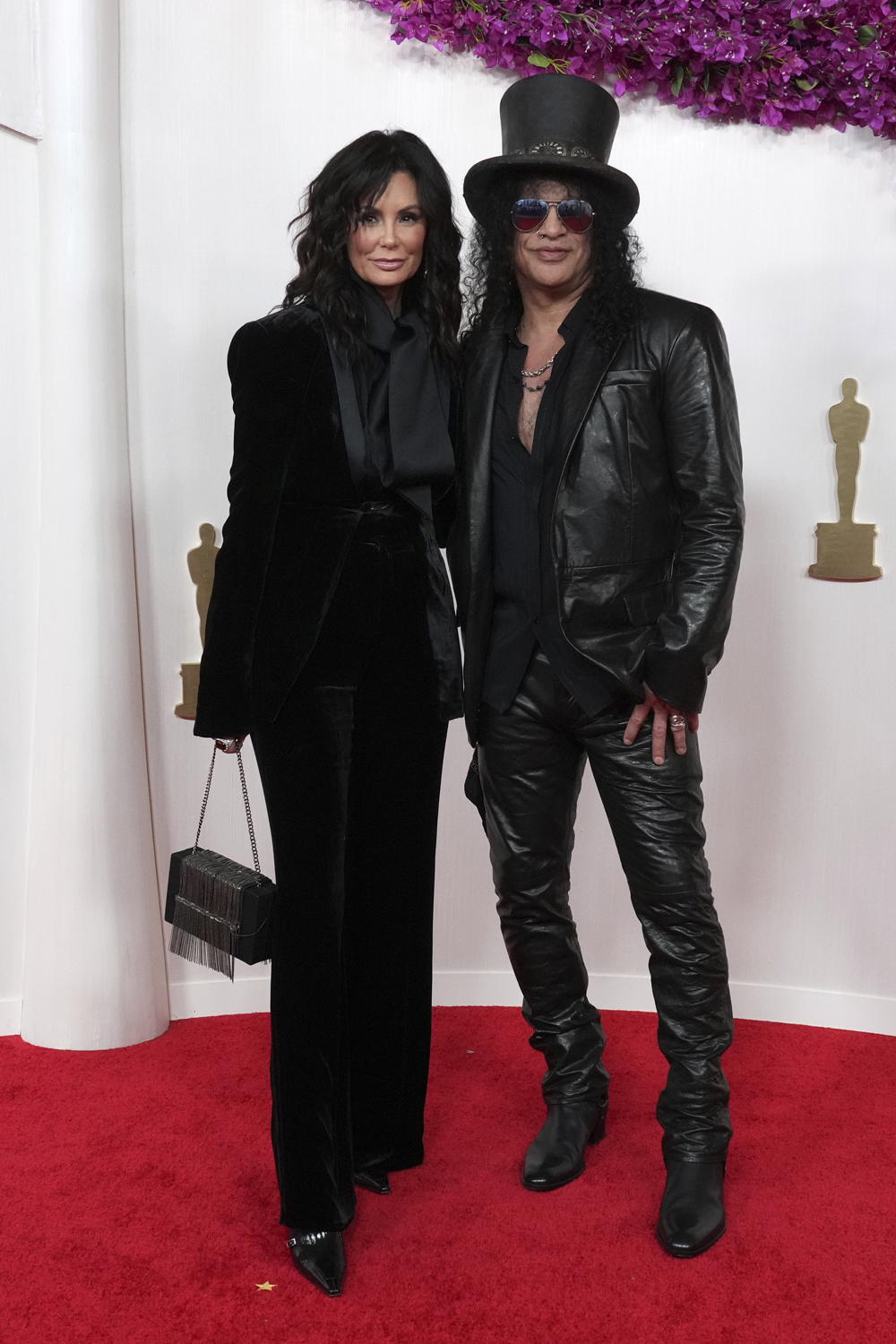 Meegan Hodges and Slash arrive at the Academy Awards in Los Angeles. Photo / AP