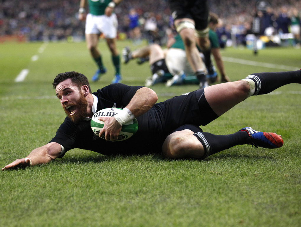 All Black Ryan Crotty scores their side's final try against Ireland. Photo / AP