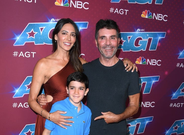 Simon Cowell with his fiance Lauren Silverman and son, Eric Cowell. Photo / Getty Images