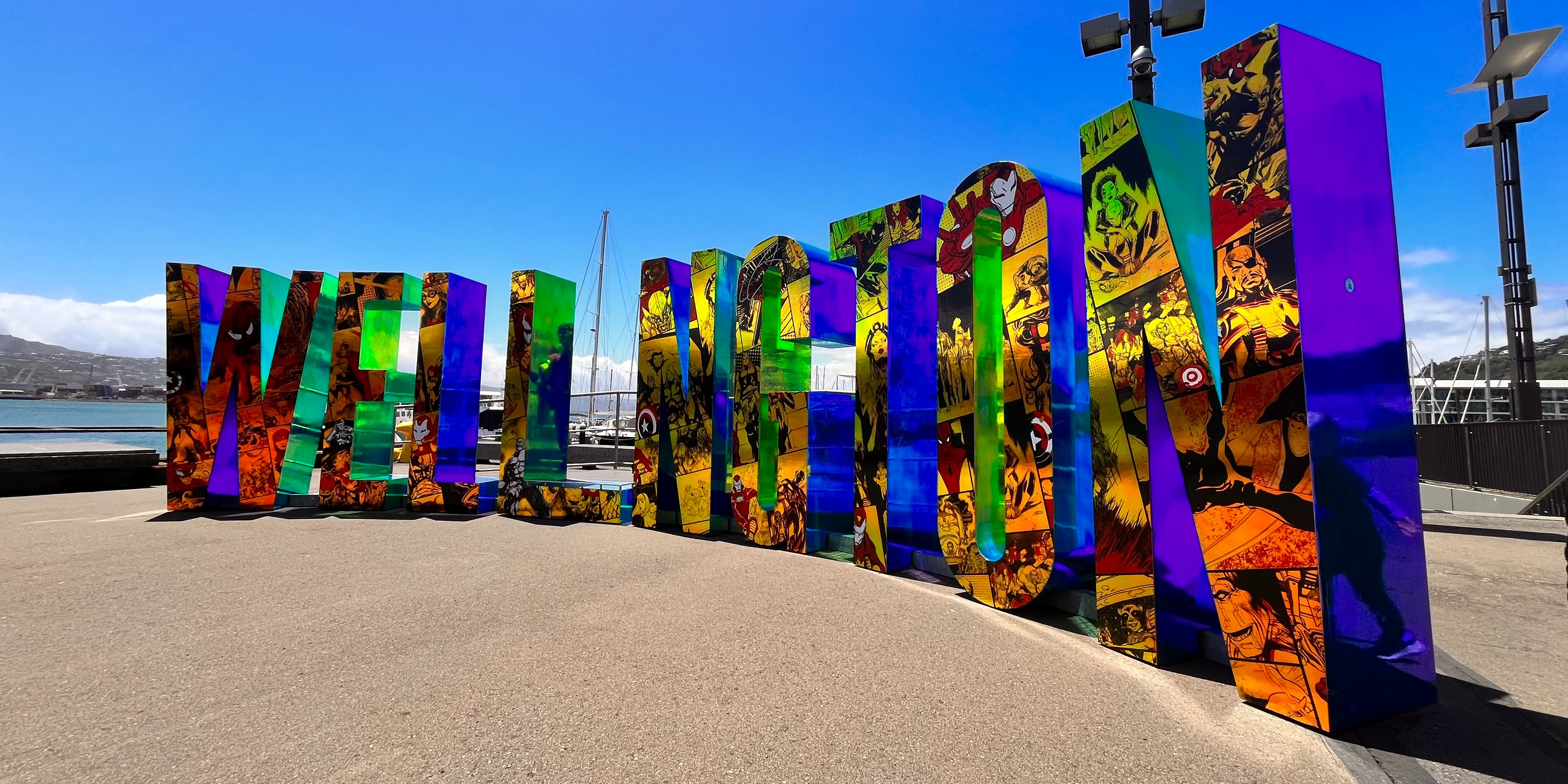The Wellington sign on the city's waterfront has been covered in Marvel comic illustrations as a nod to the Marvel: Earth's Mightiest Exhibition showing at Tākina. Photo / WellingtonNZ