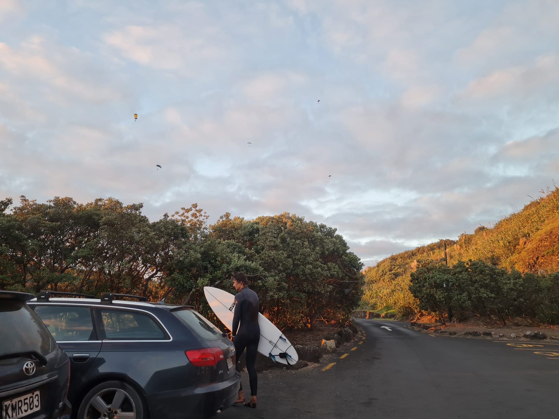 A witness took this photo of five skydivers in the air above Muriwai, minutes before the incident. Photo / Supplied