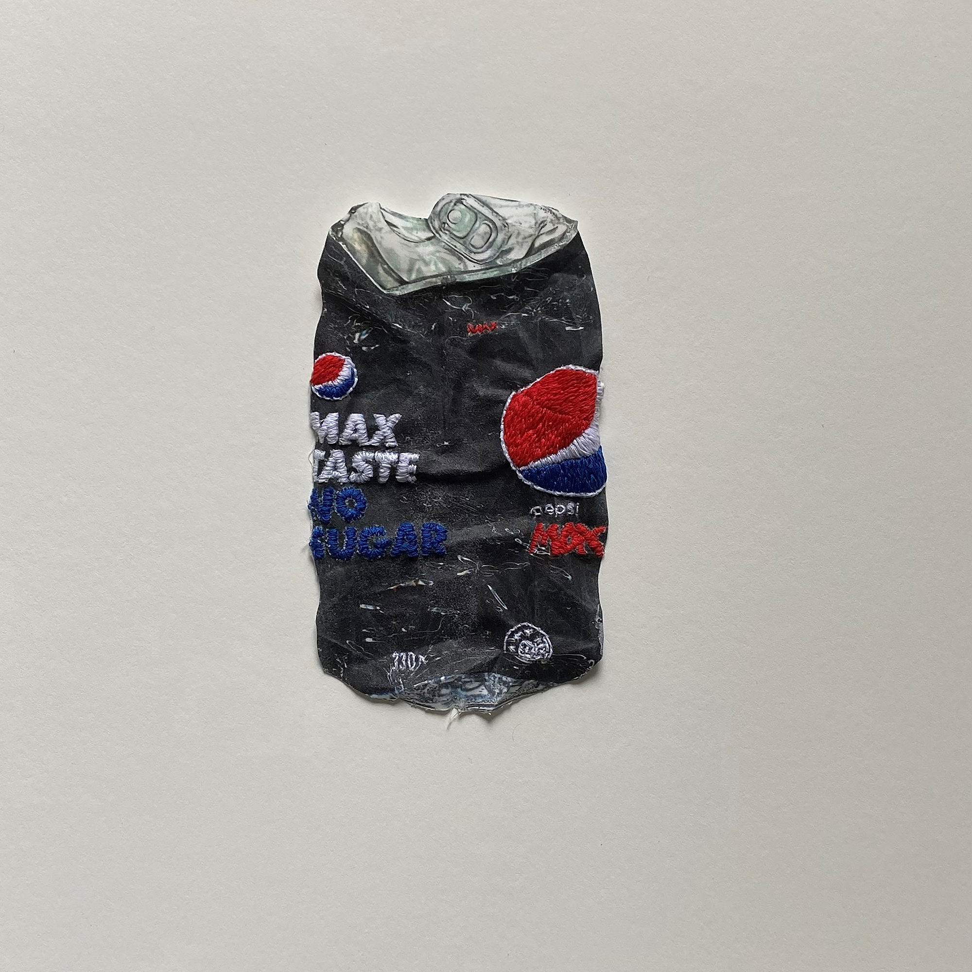 Jay Hutchinson, ‘Treasures from Dunedin Public Art Gallery Carpark – Pepsi’, 2023. Hand-embroidered fabric, 330mm x 330mm x 60mm, framed. Photo / Courtesy of the artist and Masterworks Gallery