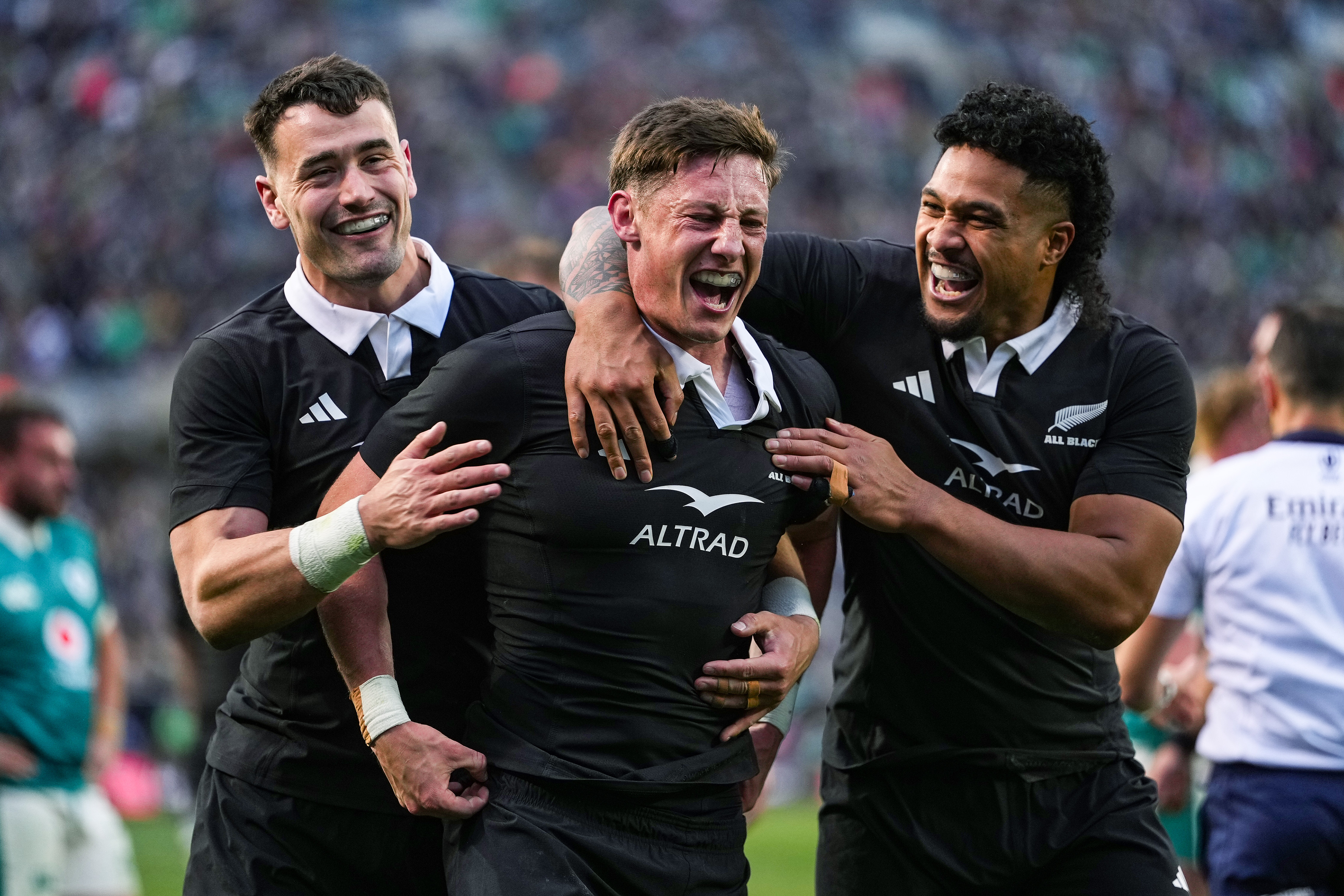Leicester Fainga'anuku (right) celebrates a try with Cam Roigard (centre) and Will Jordan (left) in 2025. Photo / Photosport