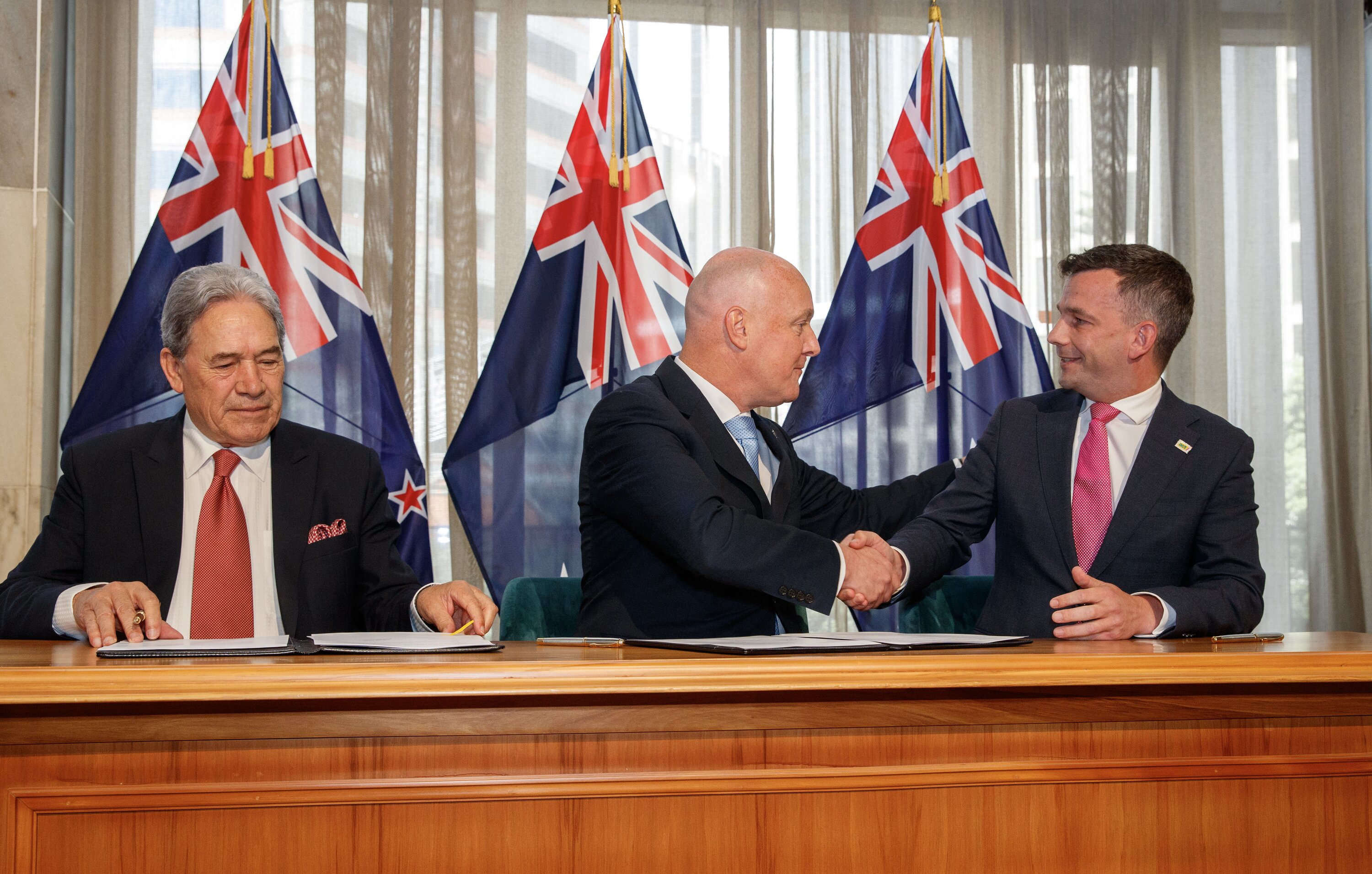 NZ First leader Winston Peters, National leader Christopher Luxon and Act leader David Seymour after signing their coalition agreement. Photo / Mark Mitchell
