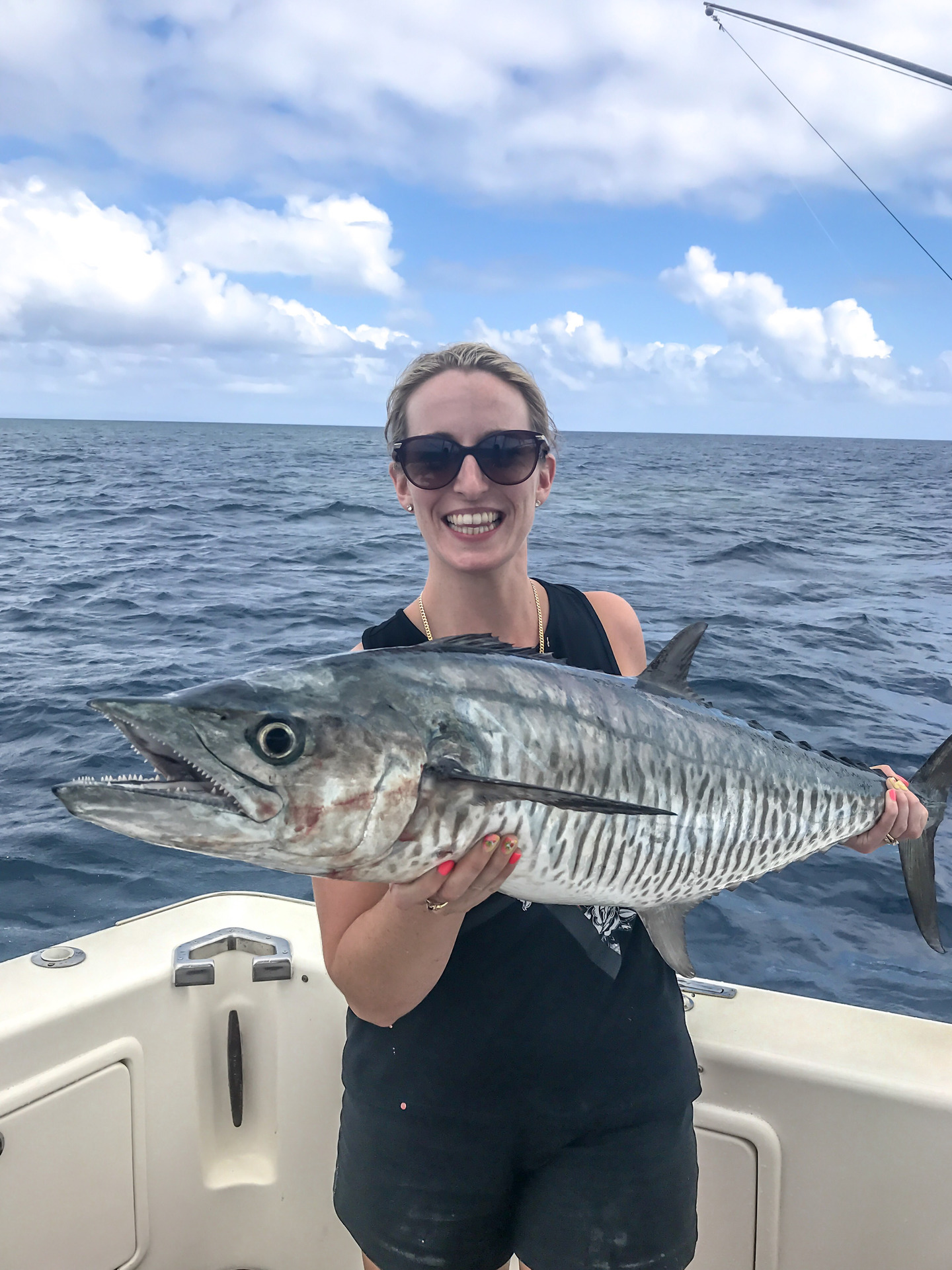 Juliette Sivertsen celebrates the biggest fish she's ever caught in her life (spanish mackerel). Photo / Supplied