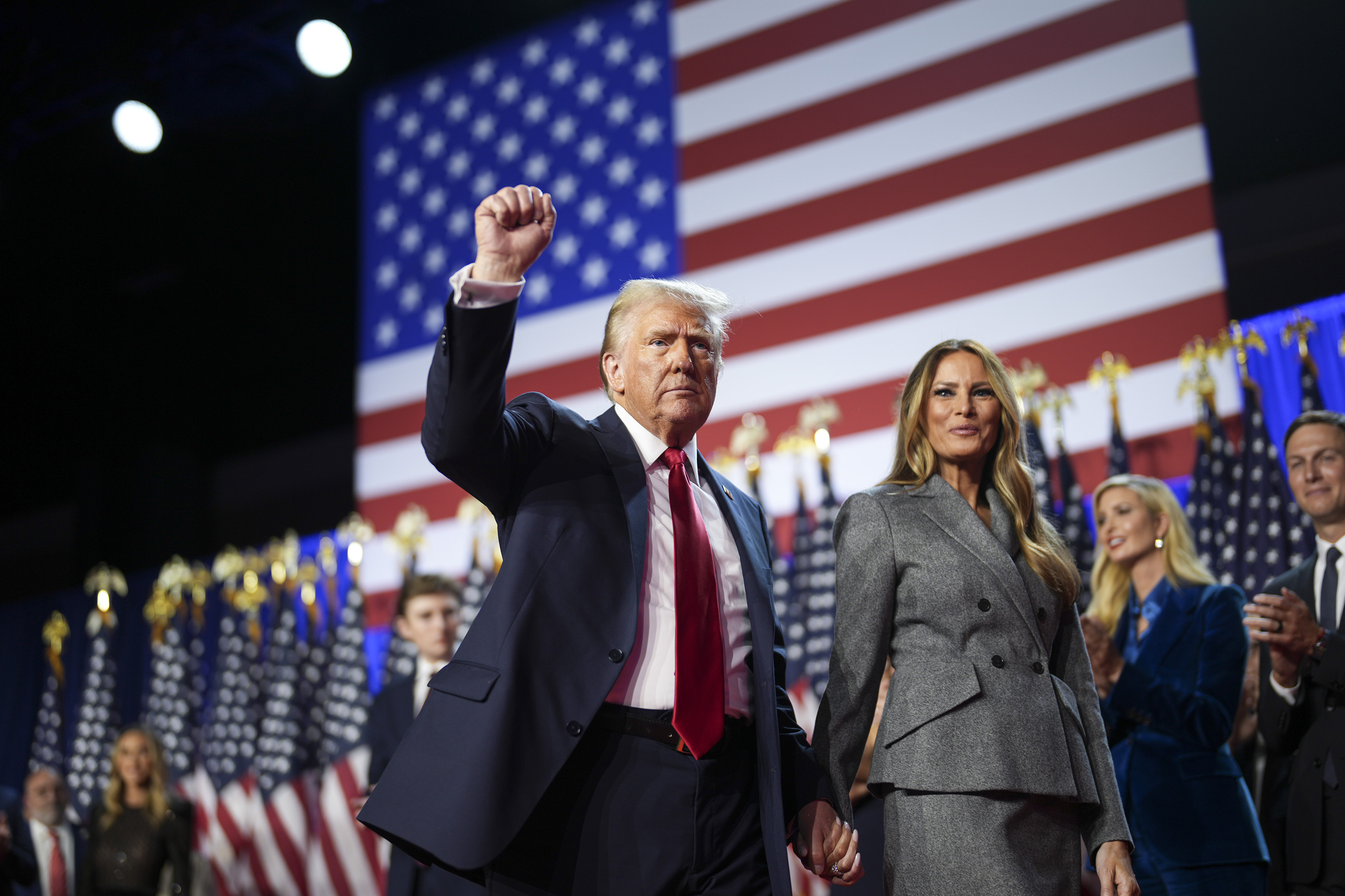 Incoming US President Donald Trump walks off stage with Melania Trump on election night event in West Palm Beach, Florida. Photo / Doug Mills, The New York Times