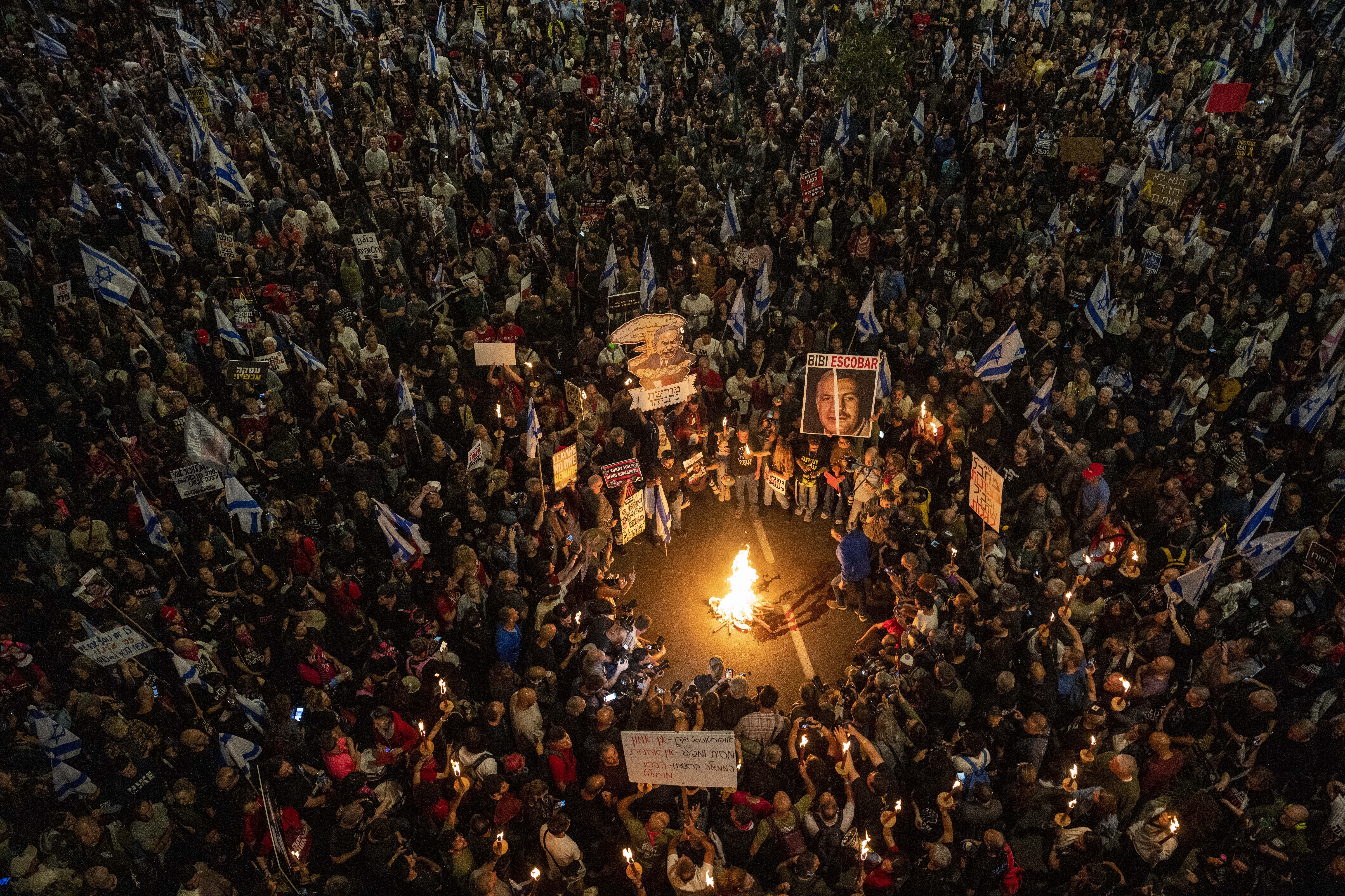 People protest against Israeli Prime Minister Benjamin Netanyahu's government and call for the release of hostages held in the Gaza Strip by the Hamas militant group in Tel Aviv, Israel. Photo / AP