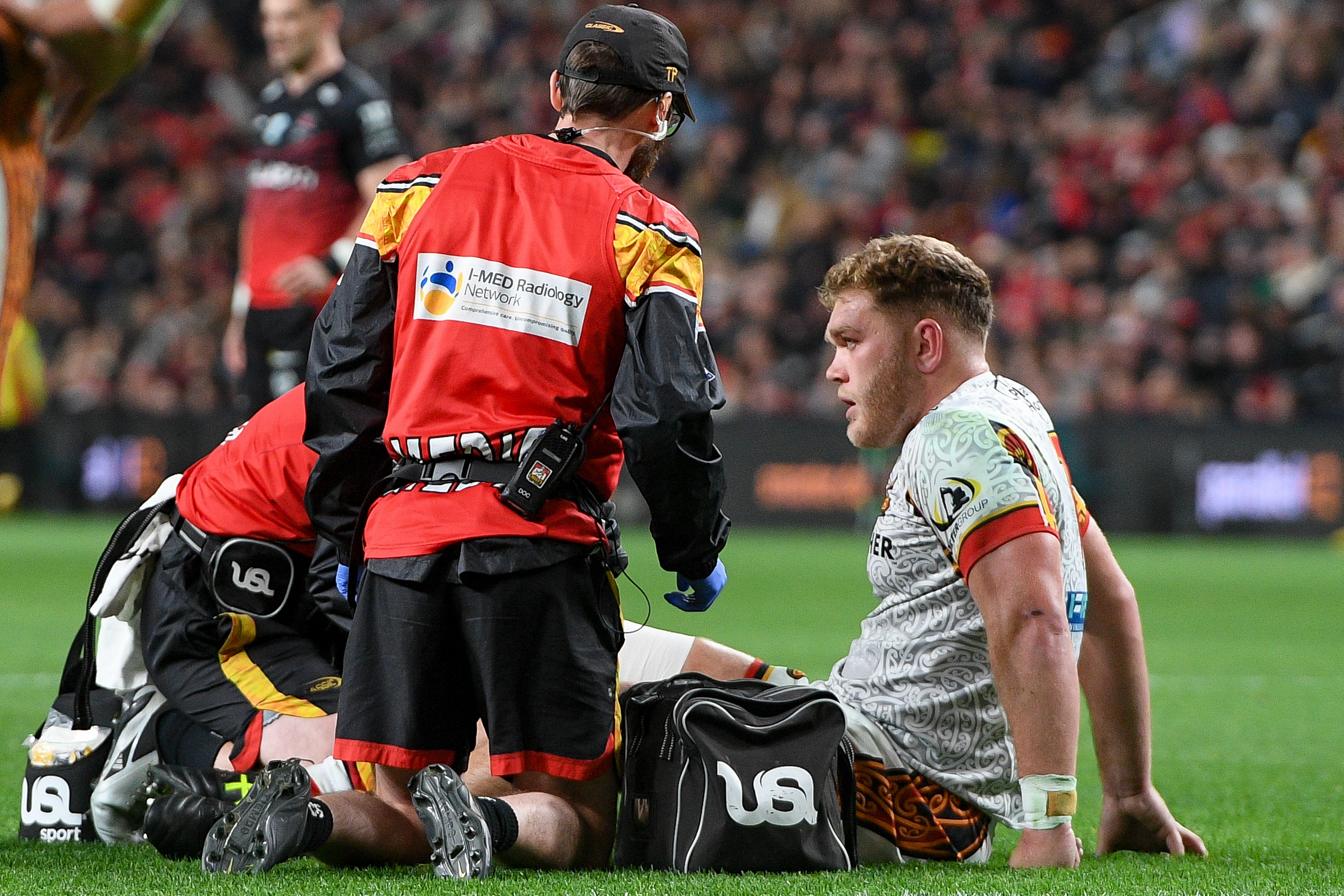Ollie Norris of the Chiefs receives medical attention. Photo / Photosport