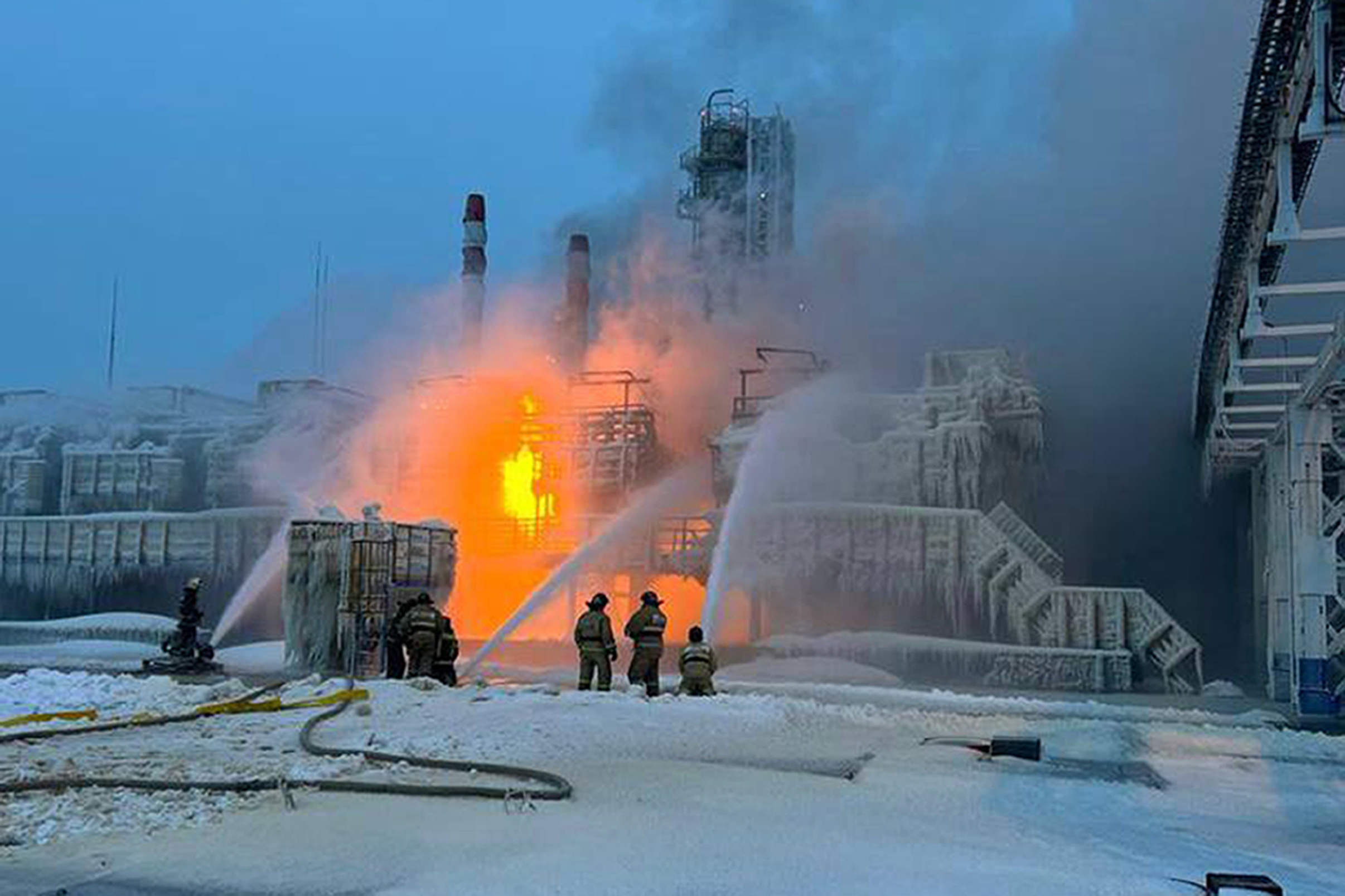 Fire fighters extinguish the blaze at Russia's second-largest natural gas producer, Novatek in Ust-Luga, 165km southwest of St Petersburg, Russia. Photo / AP