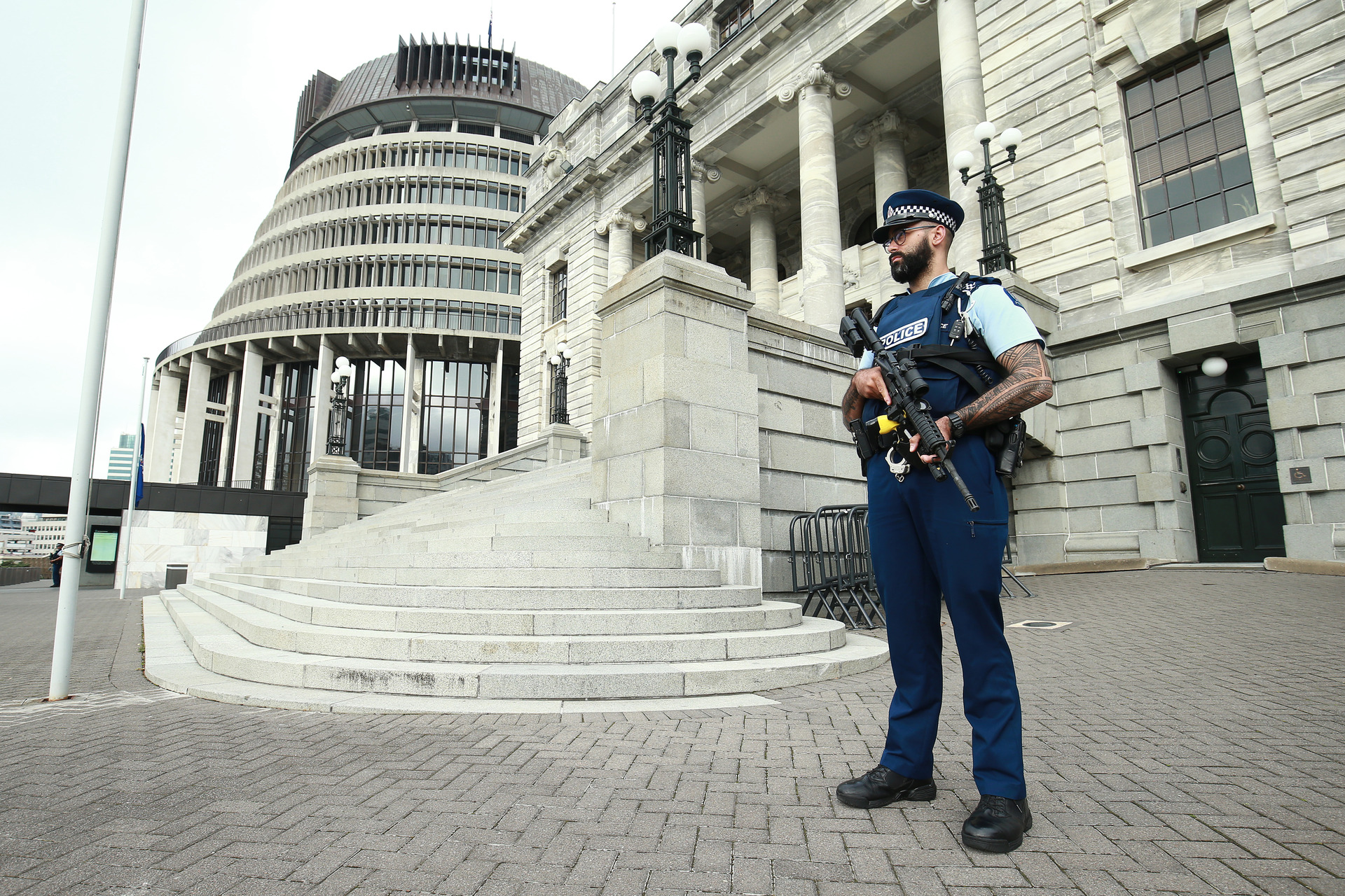 An armed police officer stands guard at Parliament. Photo / Getty Images
