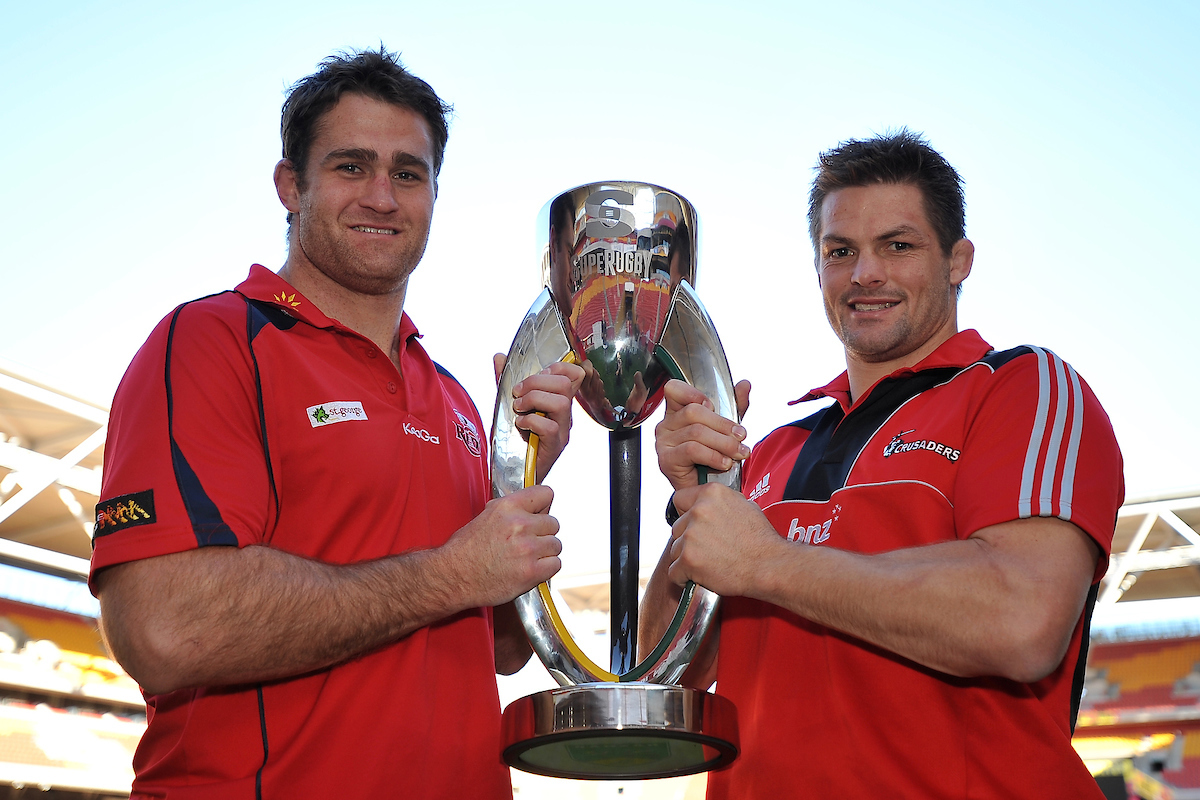 Reds skipper James Horwill and Crusaders legend Richie McCaw with the Super Rugby Trophy before the 2011 final. Photo / Photosport