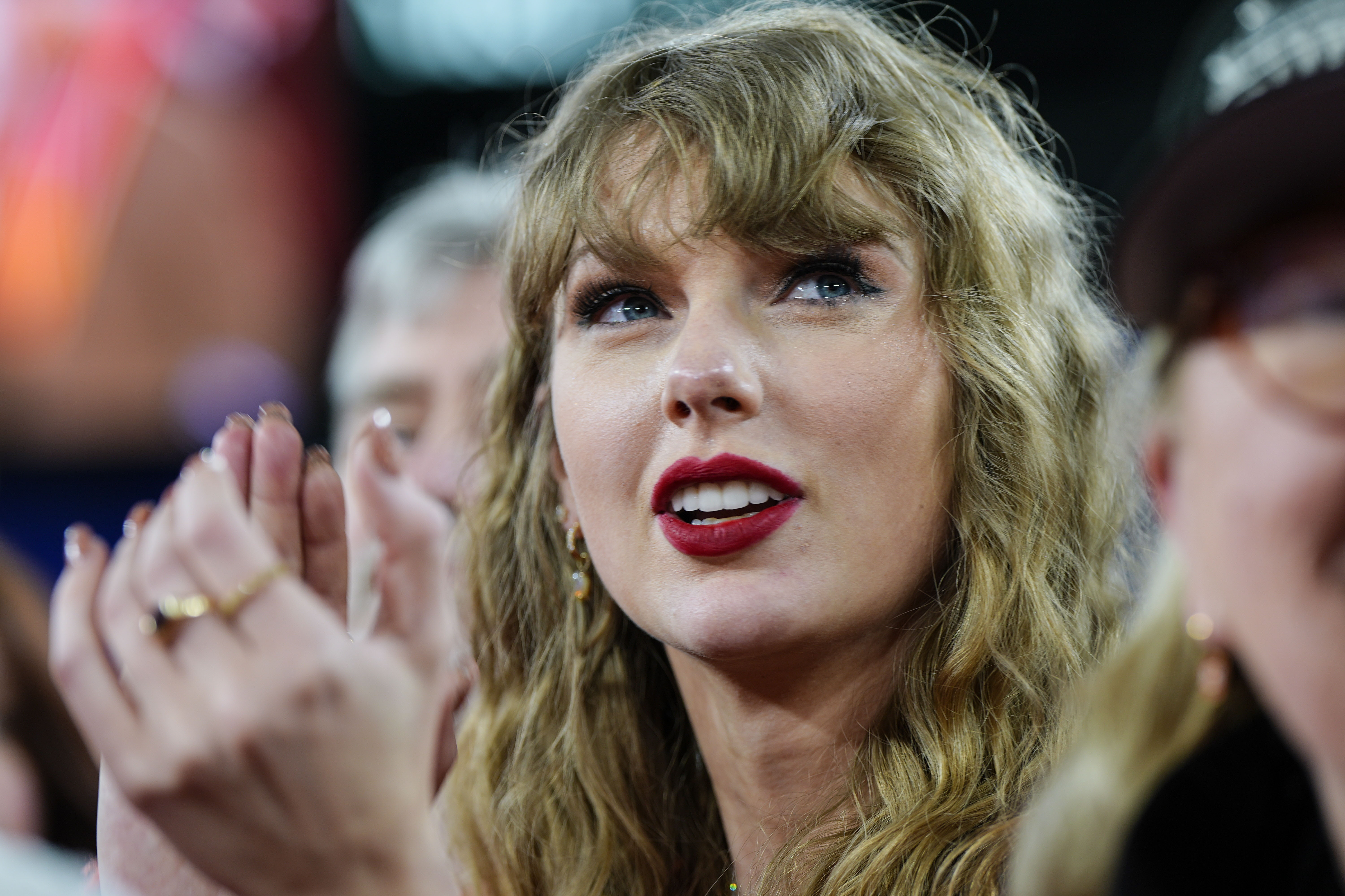 Taylor Swift stands on the field after an AFC Championship NFL football game. Photo / AP
