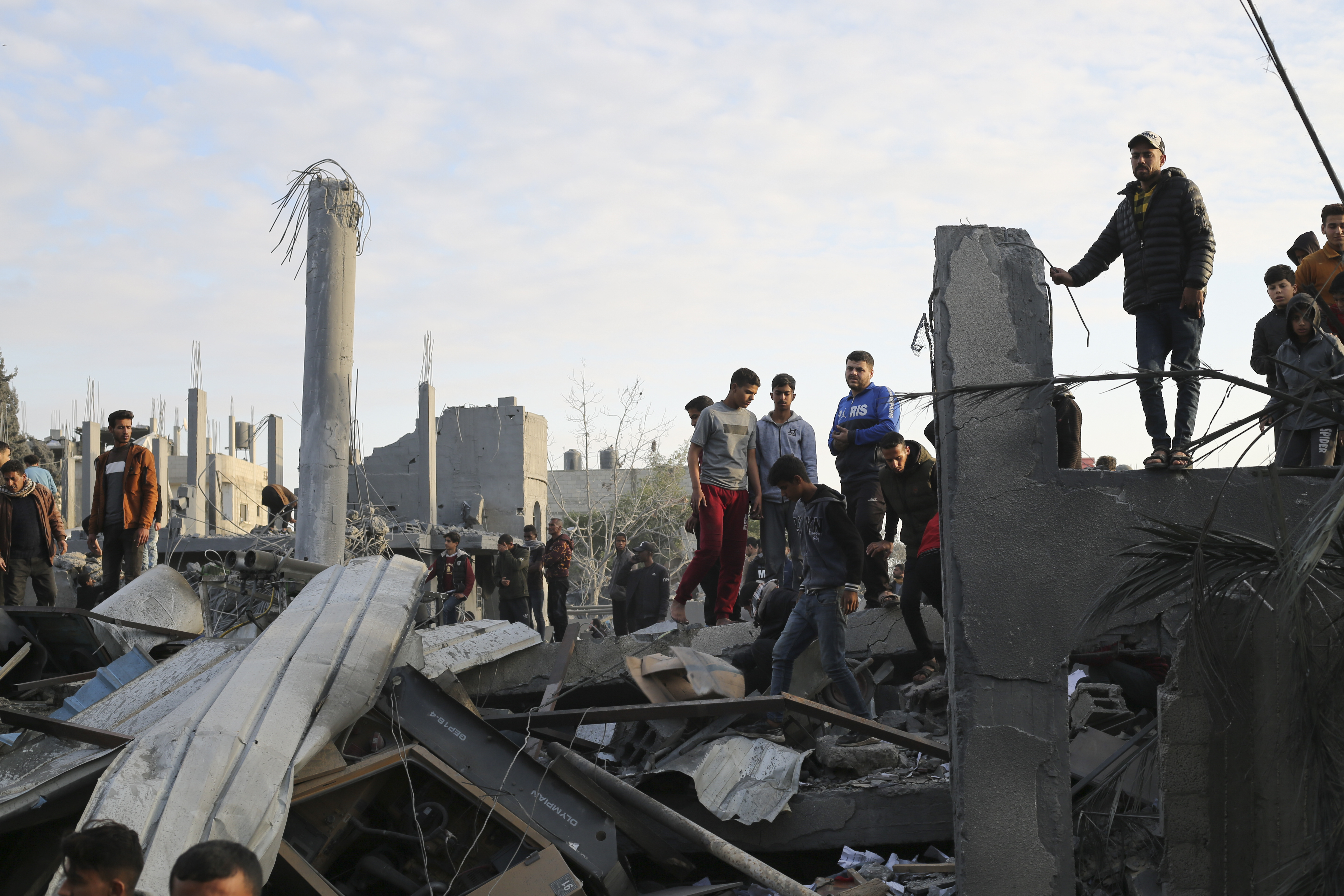 Palestinians look at a mosque destroyed  abyn Israeli strike in Rafah, Gaza Strip. Photo / AP