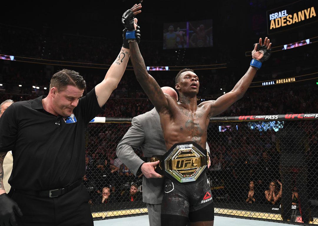  UFC President Dana White places the interim middleweight championship belt on Israel Adesanya after defeating Kelvin Gastelum. Photo / Getty