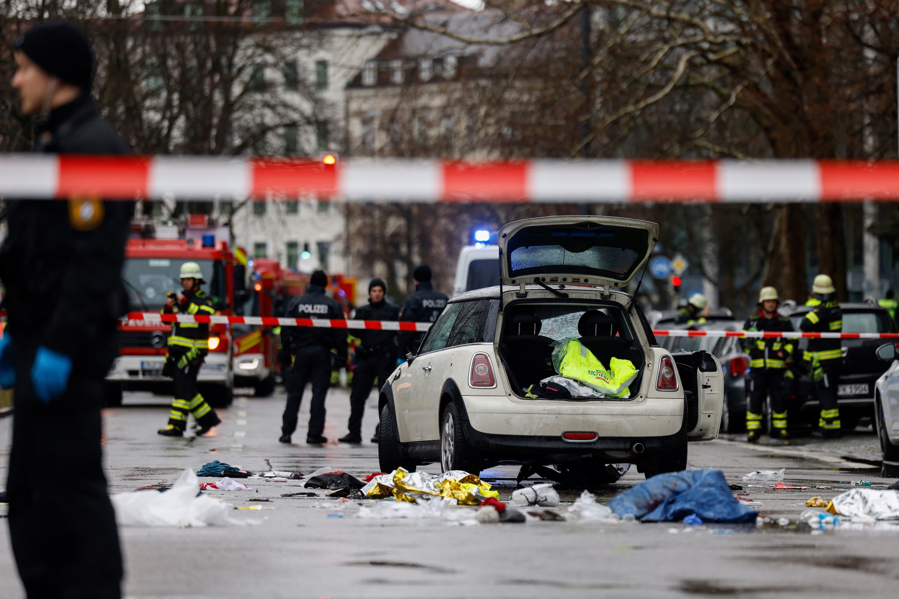 Members of the emergency services work at the scene where a car drove into a crowd in the southern German city of Munich. Photo / AFP