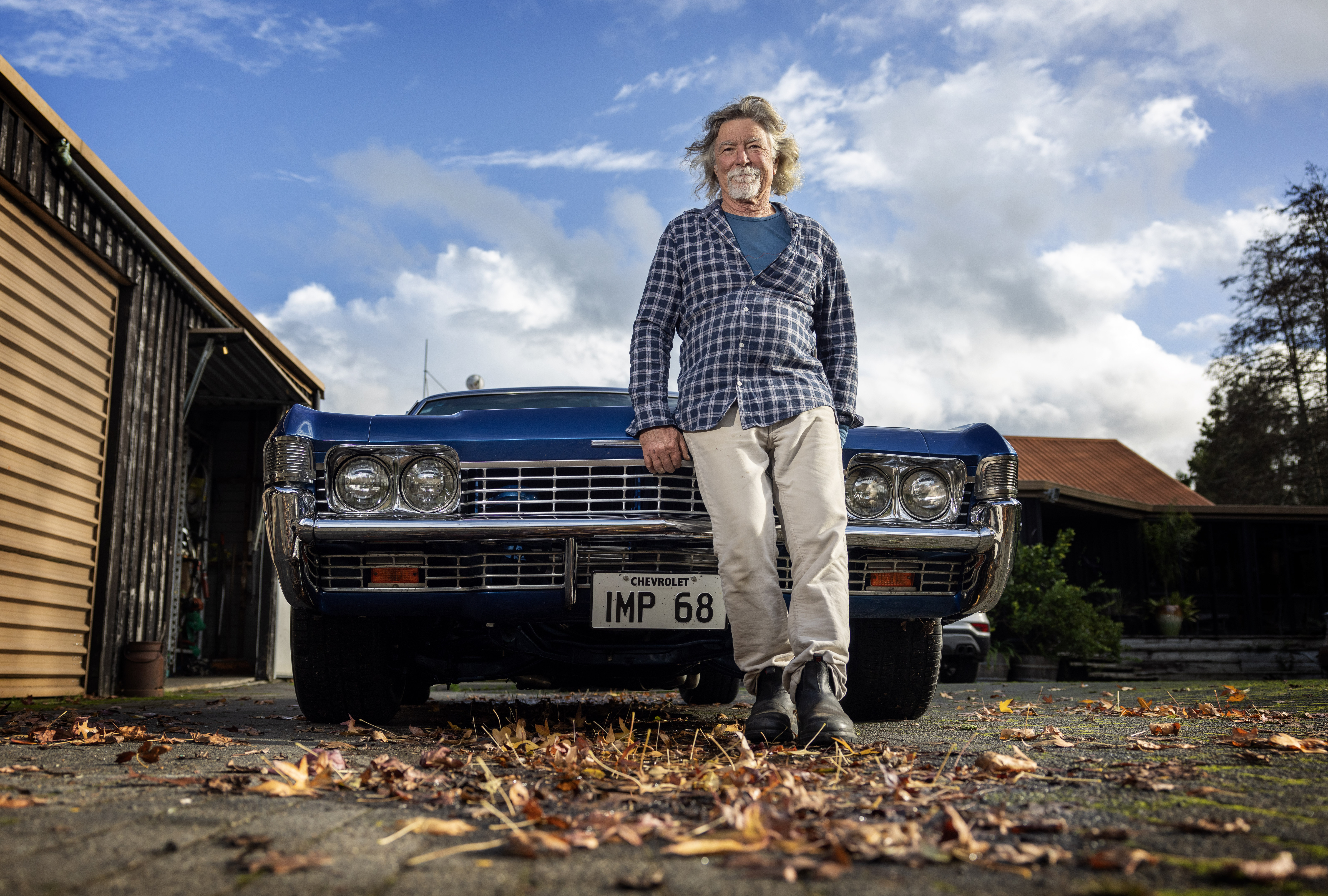 Chris Hawkings at his Waikato home with his beloved Chevrolet Impala hot rod. Photo / Mike Scott