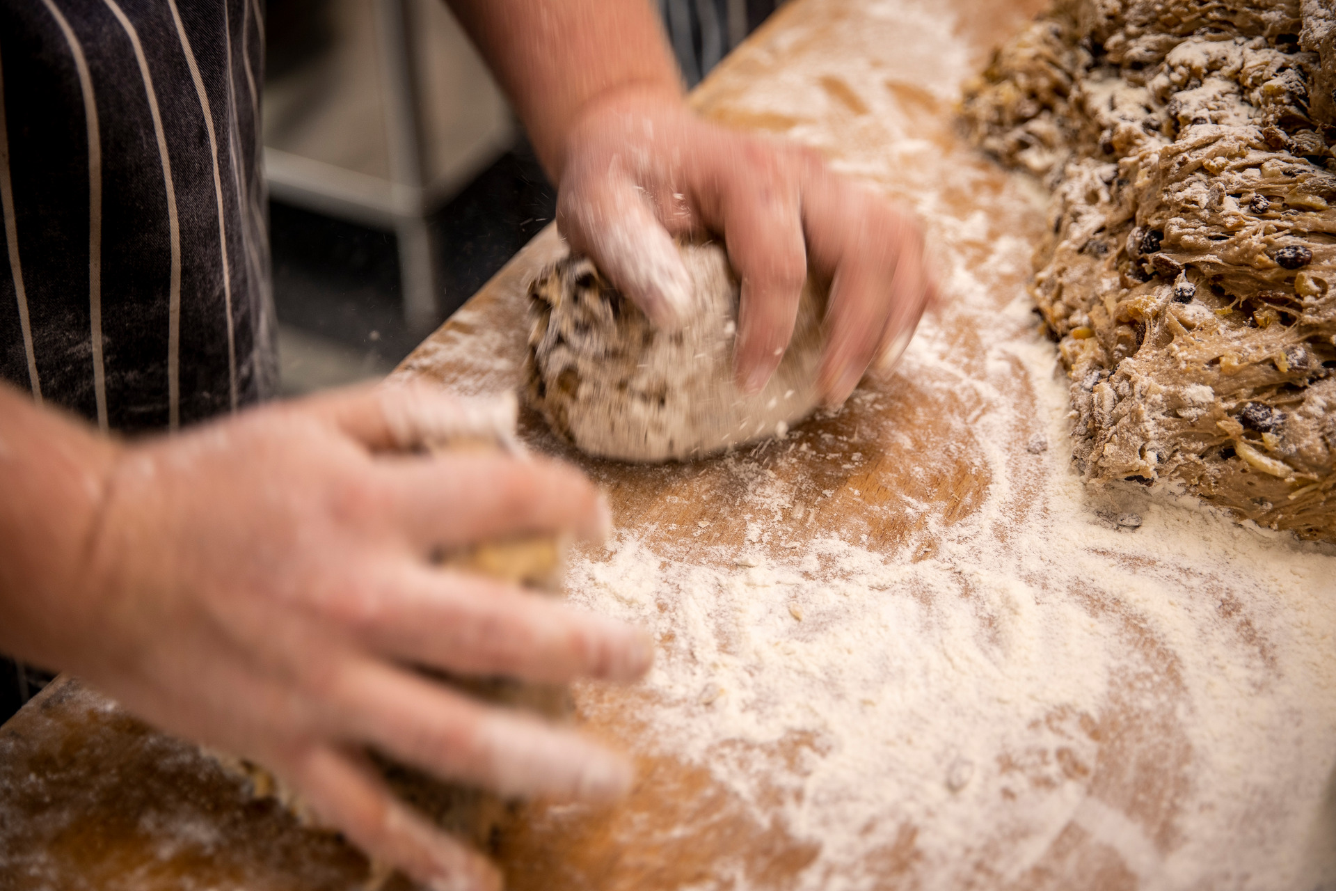 It took three years for Patrick Welzenbach, Daily Bread co-owner and stollen baker, to perfect his double-handed kneading technique. Photo/Michael Craig