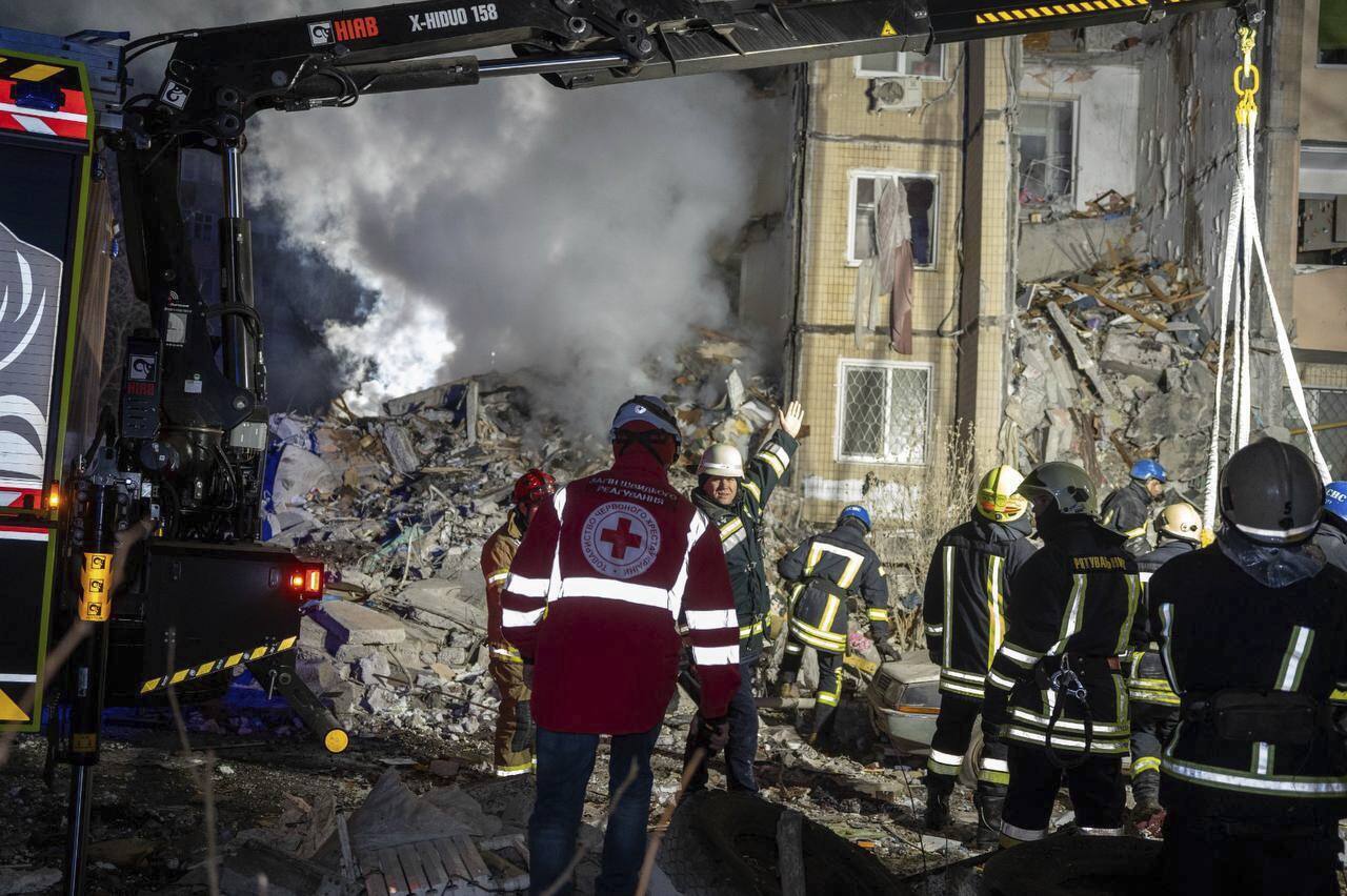 Ukrainian Emergency Service workers clear the rubble after a Russian attack on residential neighbourhood in Odesa. Photo / AP