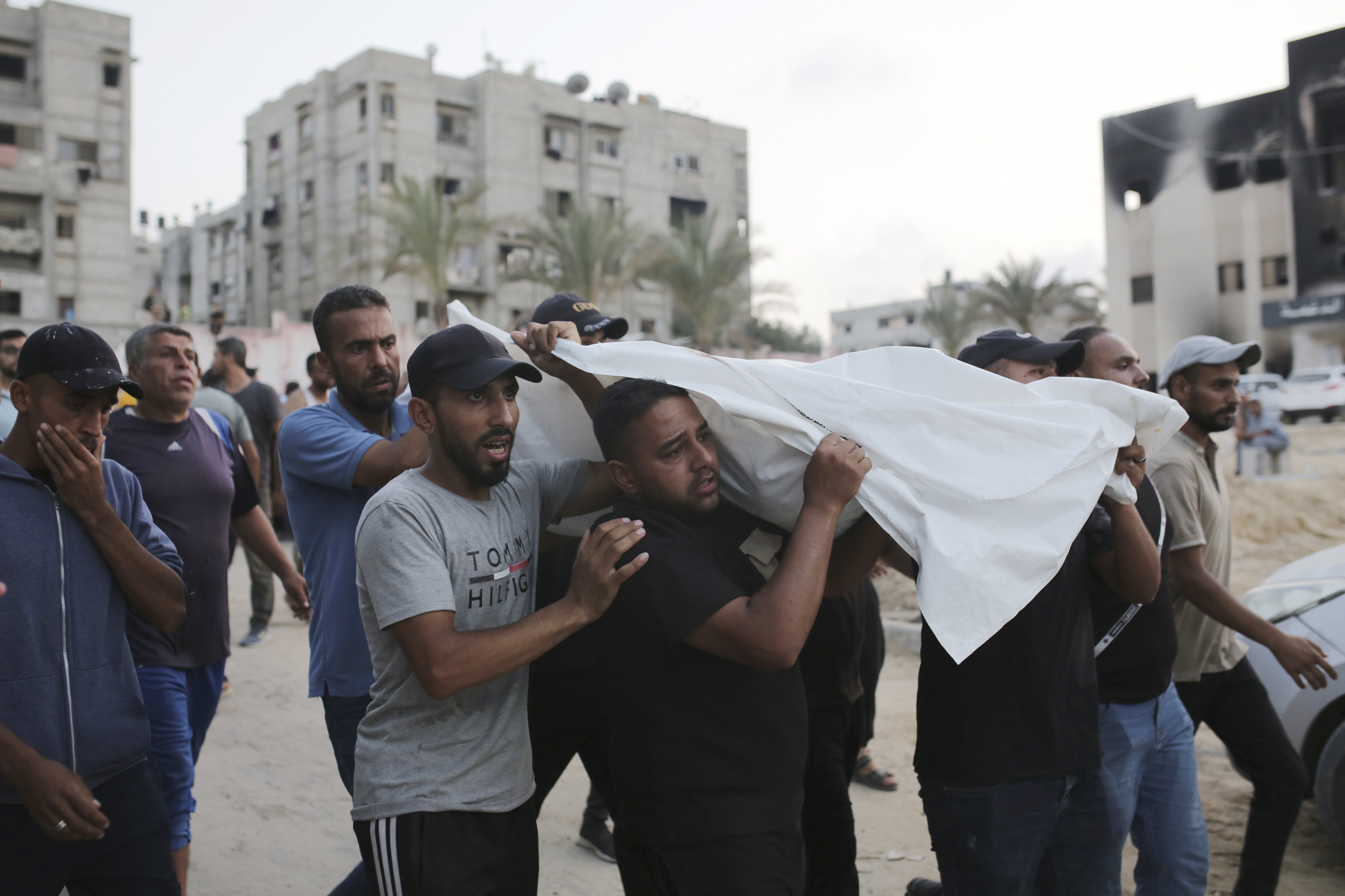 Palestinians carry a person killed by Israeli bombardment, one of the thousands of victims of the ongoing war between Israel and Hamas. Photo / AP