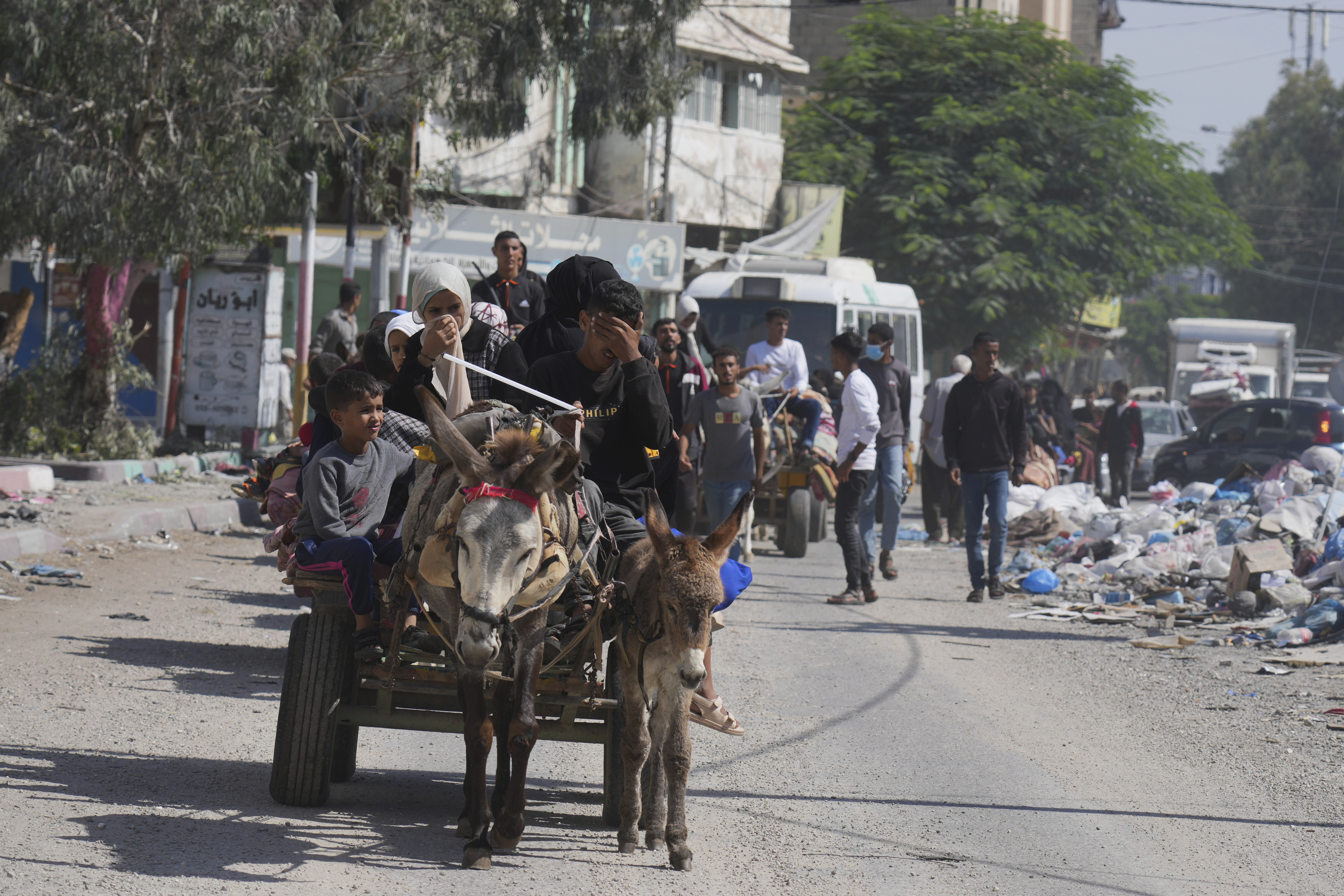 Families in cars, trucks and donkey carts packed with their possessions head south from Gaza City. Photo / AP