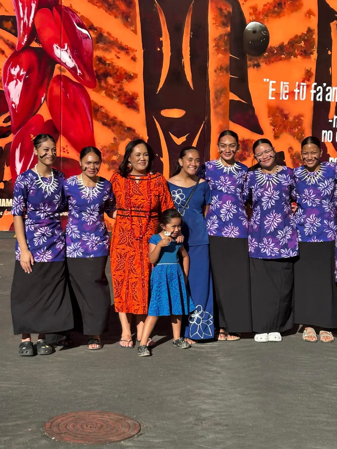 Vasa Fia Collins (orange dress) with her daughters and whānau.