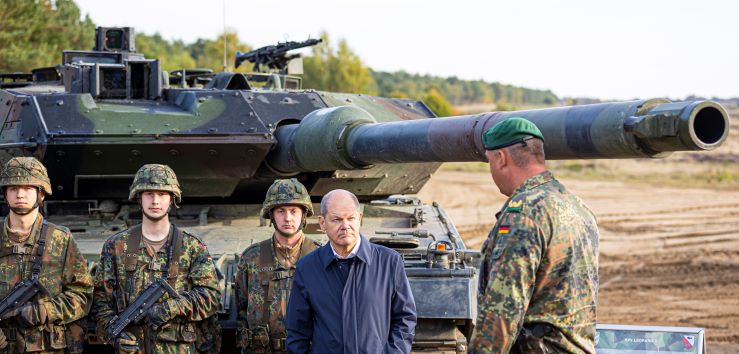 German Chancellor Olaf Scholz talks to German army Bundeswehr soldiers at a 