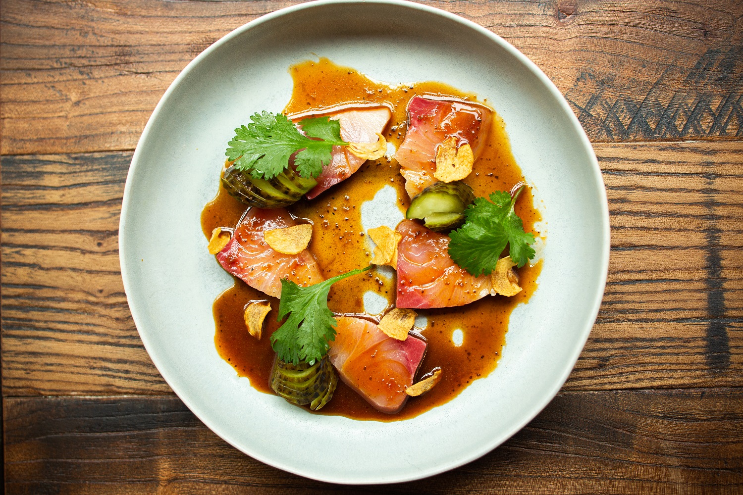 The kingfish sashimi dressed in Szechuan chilli oil and black vinegar. Photo / Babiche Martens