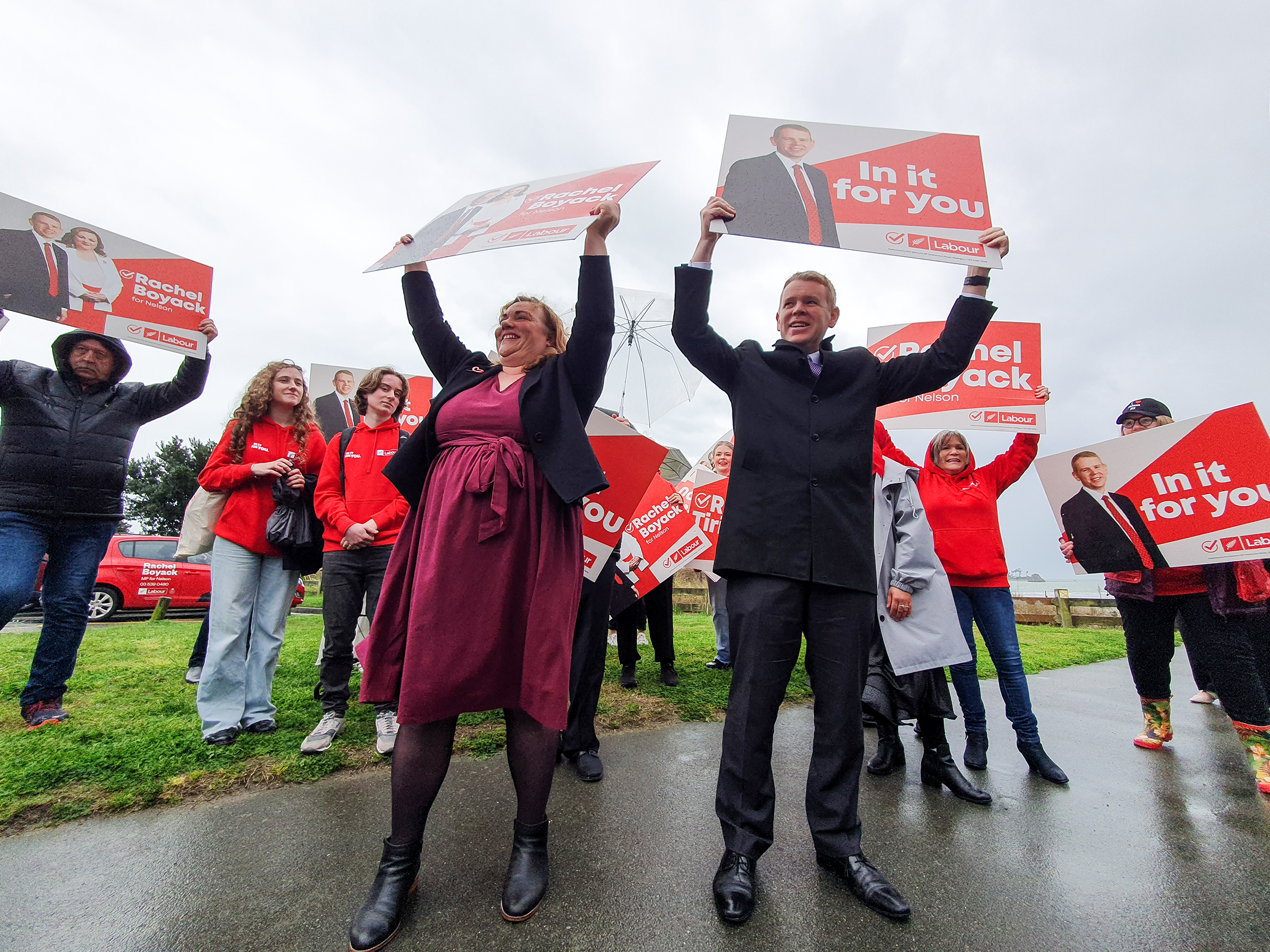 Labour Party leader Chris Hipkins (right) waving signs in Nelson while on the campaign trail in recent days. Photo / Tim Cuff
