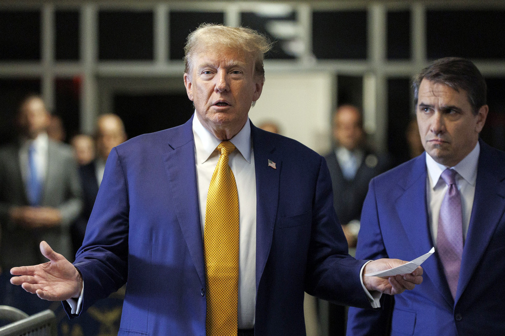 Former President Donald Trump, with his lawyer Todd Blanche, speaks to members of the media as he arrives at court. Photo / AP