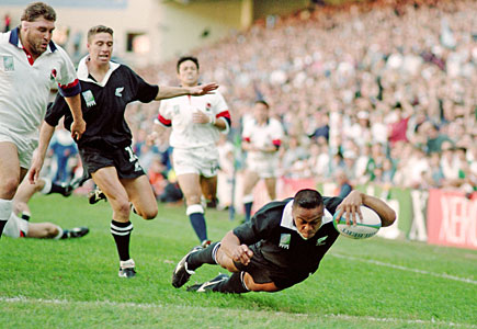 Blockbusting winger Jonah Lomu of New Zealand dives over for one of his four tries against England in the semifinal of the 1995 World Cup. Photo / Getty Images