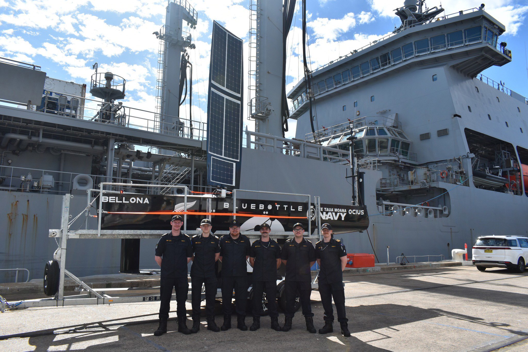 Navy crew grab a photo with their new boat. Photo / ABIS Jasmine Saunders