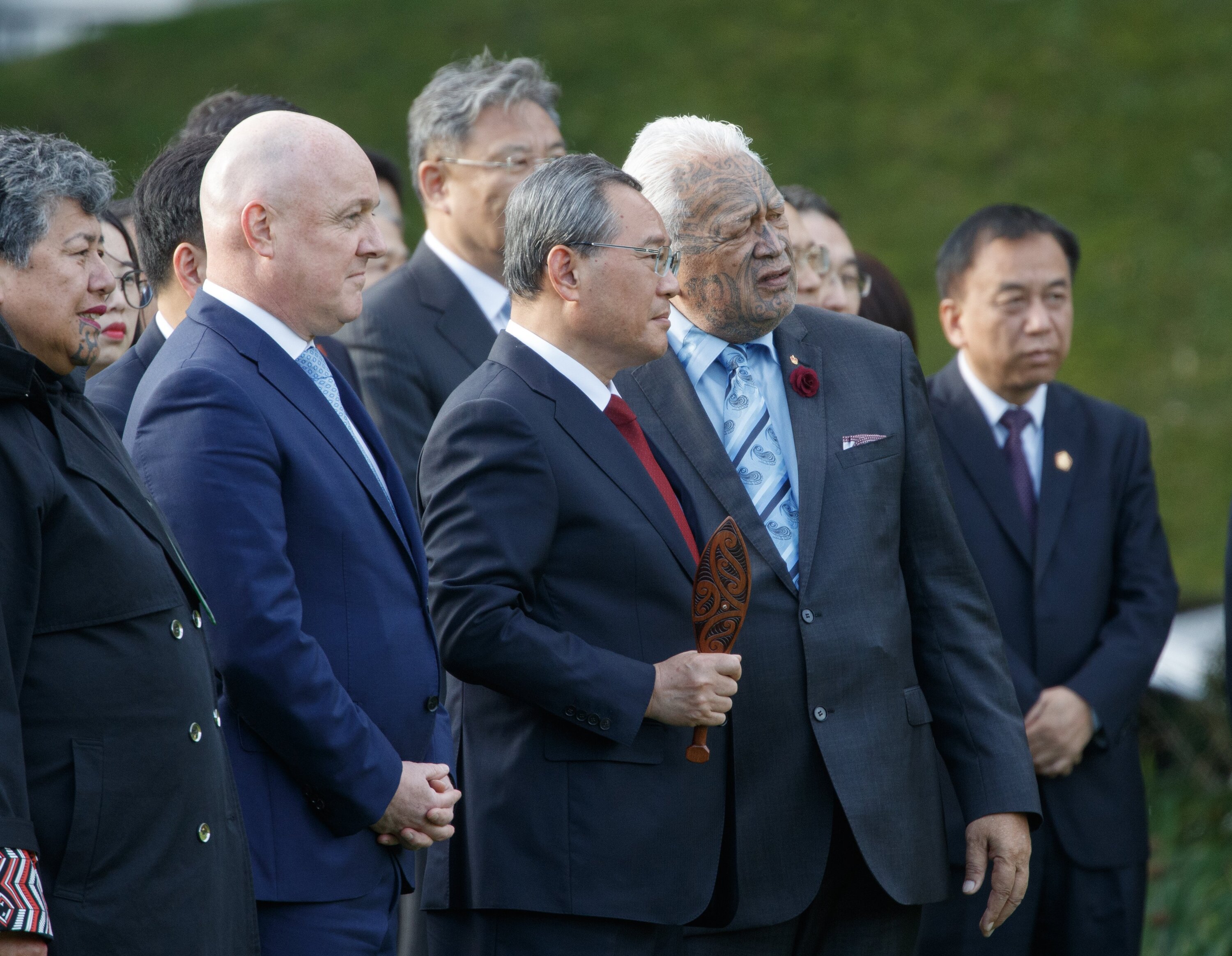 Chinese Premier Li Qiang is escorted by Prime Minister Christopher Luxon and kaumatua Joe Harawira during his official welcome at Government House. Photo / Mark Mitchell   