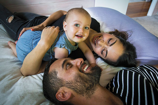 Claudia Aull, Mike Cameron and 10-month-old Harper enjoy hugs. Photo / Jason Oxenham