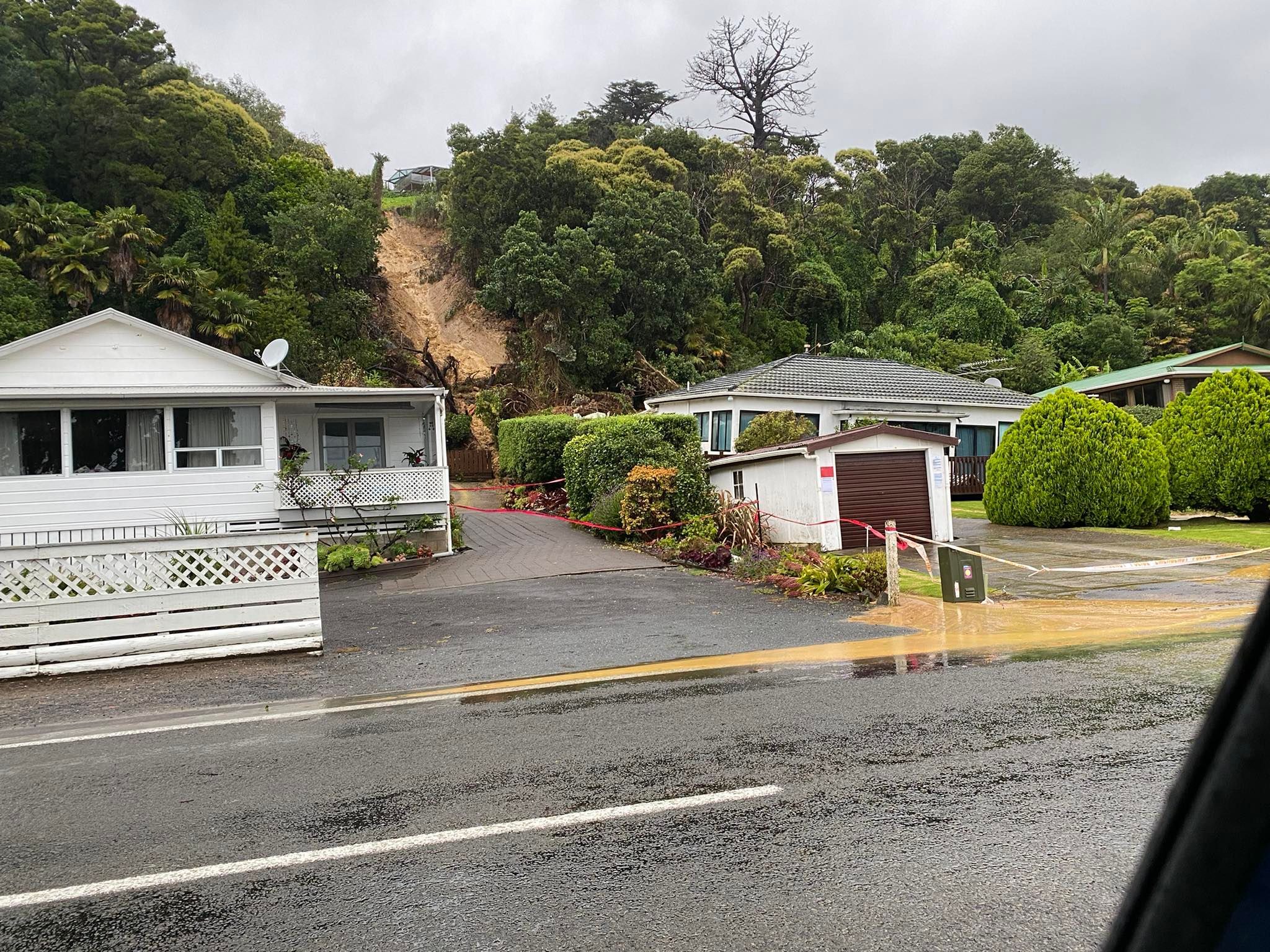 A property in Thornton Bay north of Thames now appears to have slipped off its foundations. The property was badly damaged after the deluge that hit the region at the end of January. Photo / Karl Williams