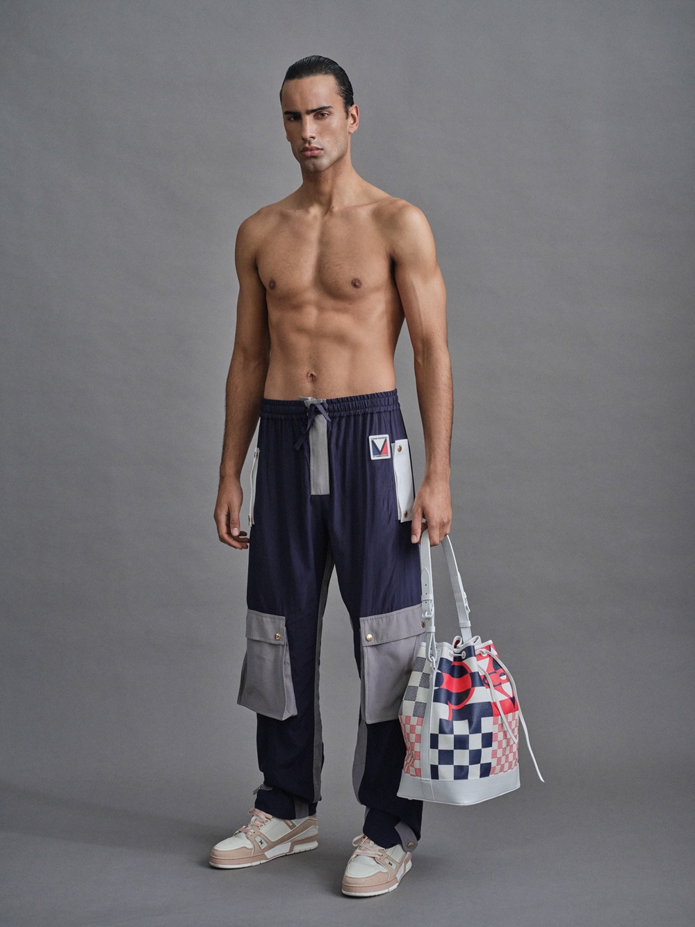 Utilitarian trousers rendered with subtle details of the brand's monogram motifs also nods to the style and colours
of maritime signal flags. Photo / Derek Henderson