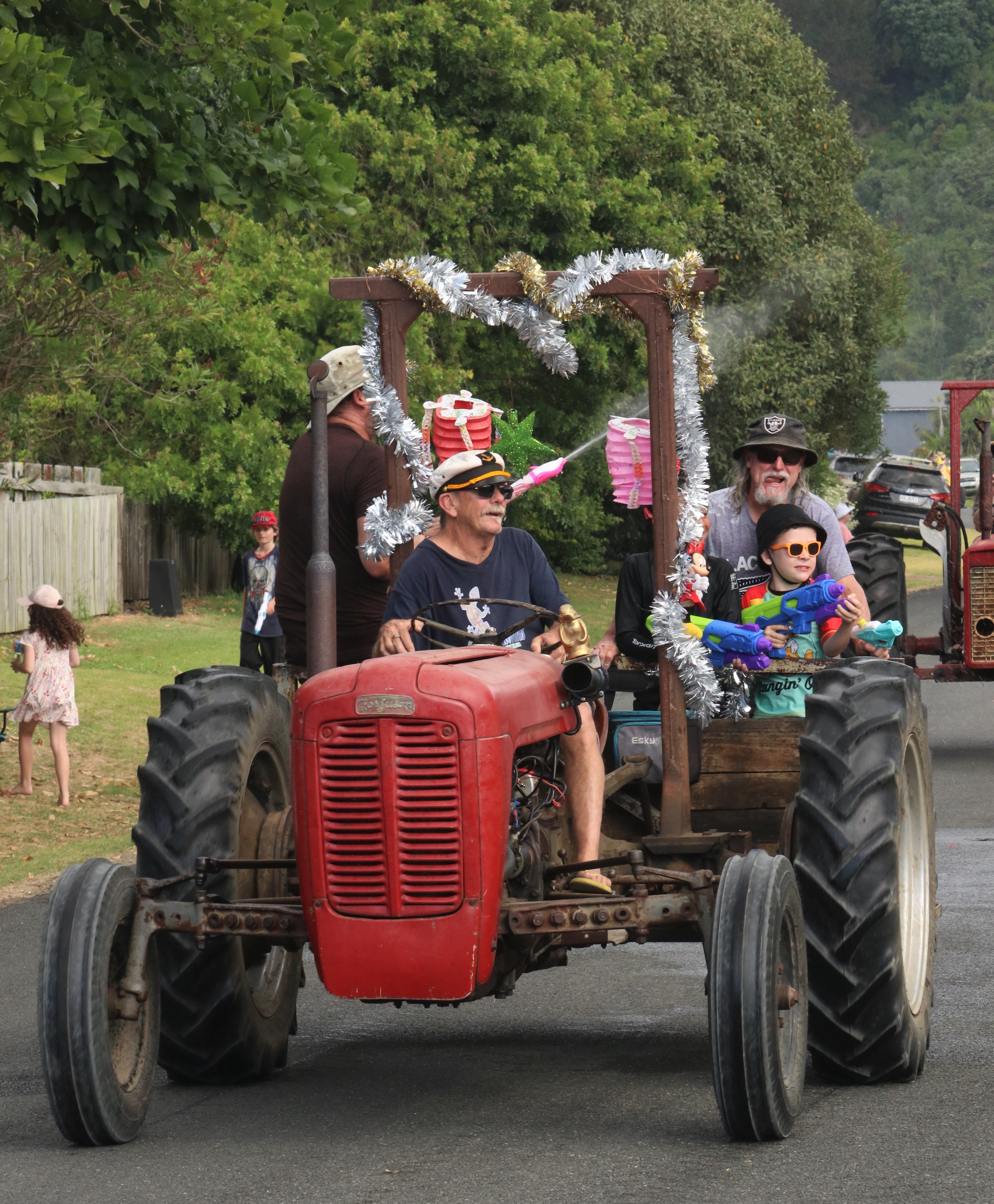 A festive tractor defends itself against a water gun attack. Photo / Peter de Graaf