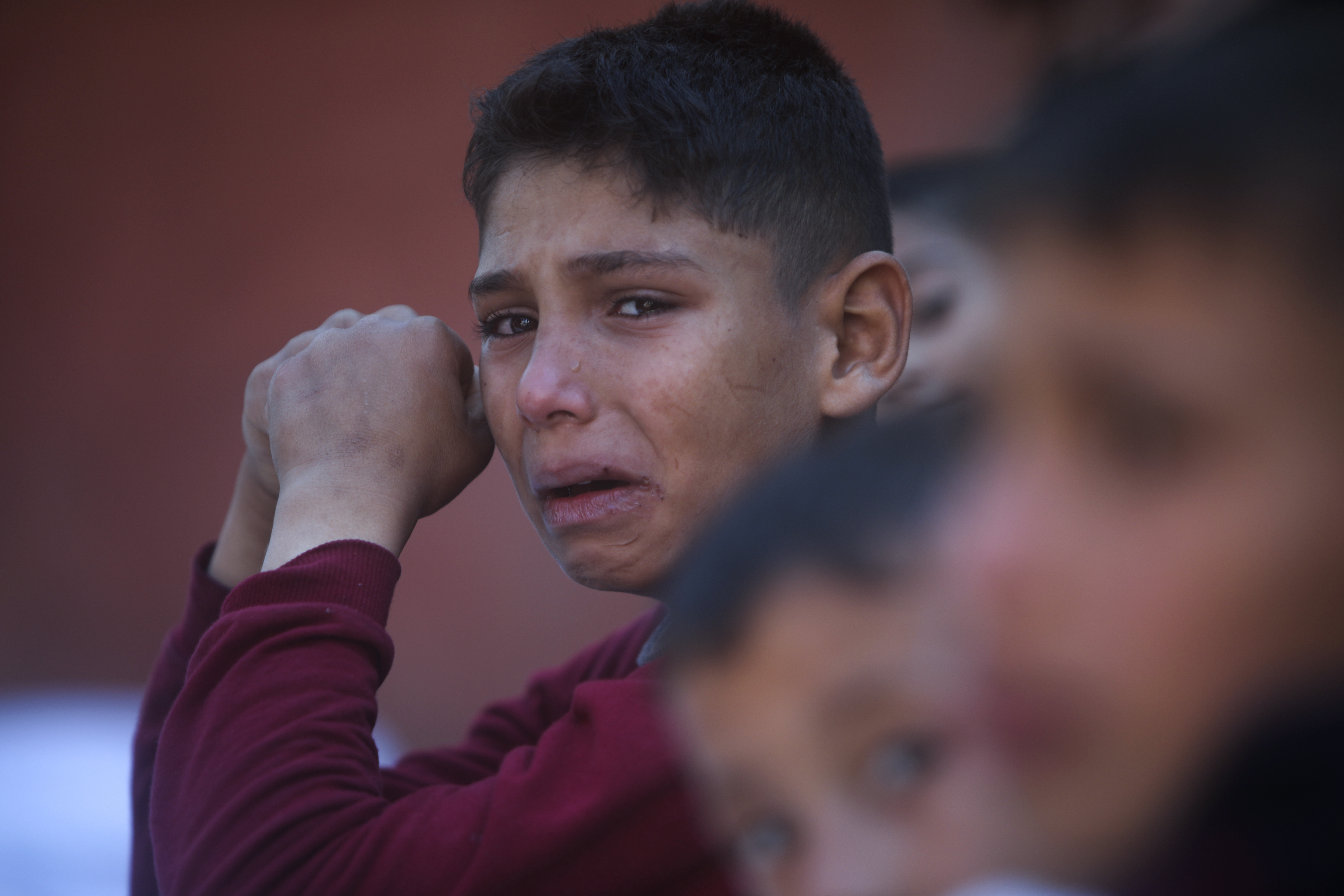A Palestinian boy cries for his relatives who were killed in the Israeli bombardment of the Gaza Strip, at Nasser hospital in Khan Younis. Photo / AP