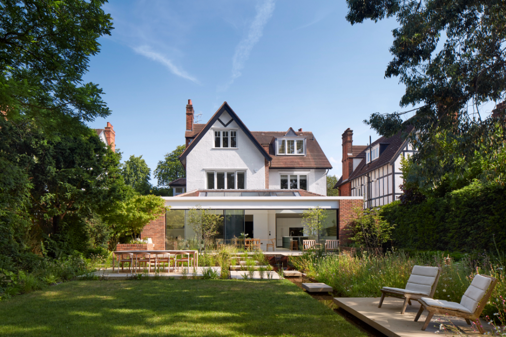 Cox Architects extended the home with the addition of a glass-walled pavilion.