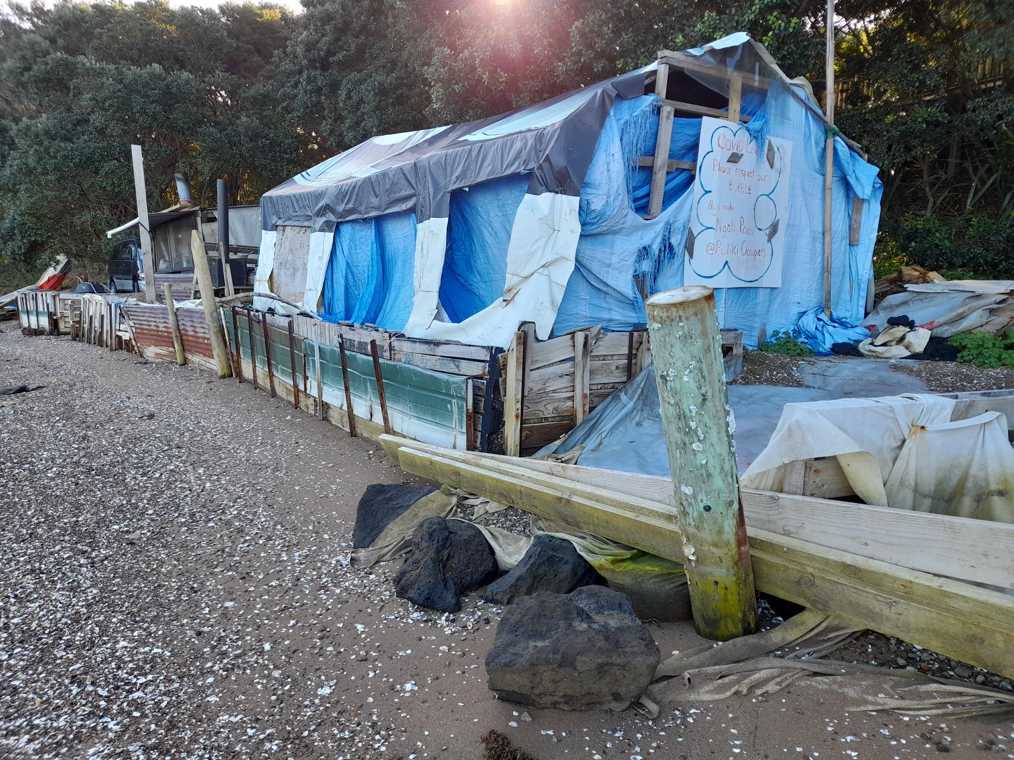 A neighbour says two-and-a-half years of putting up with these structures on the beach is far too long.