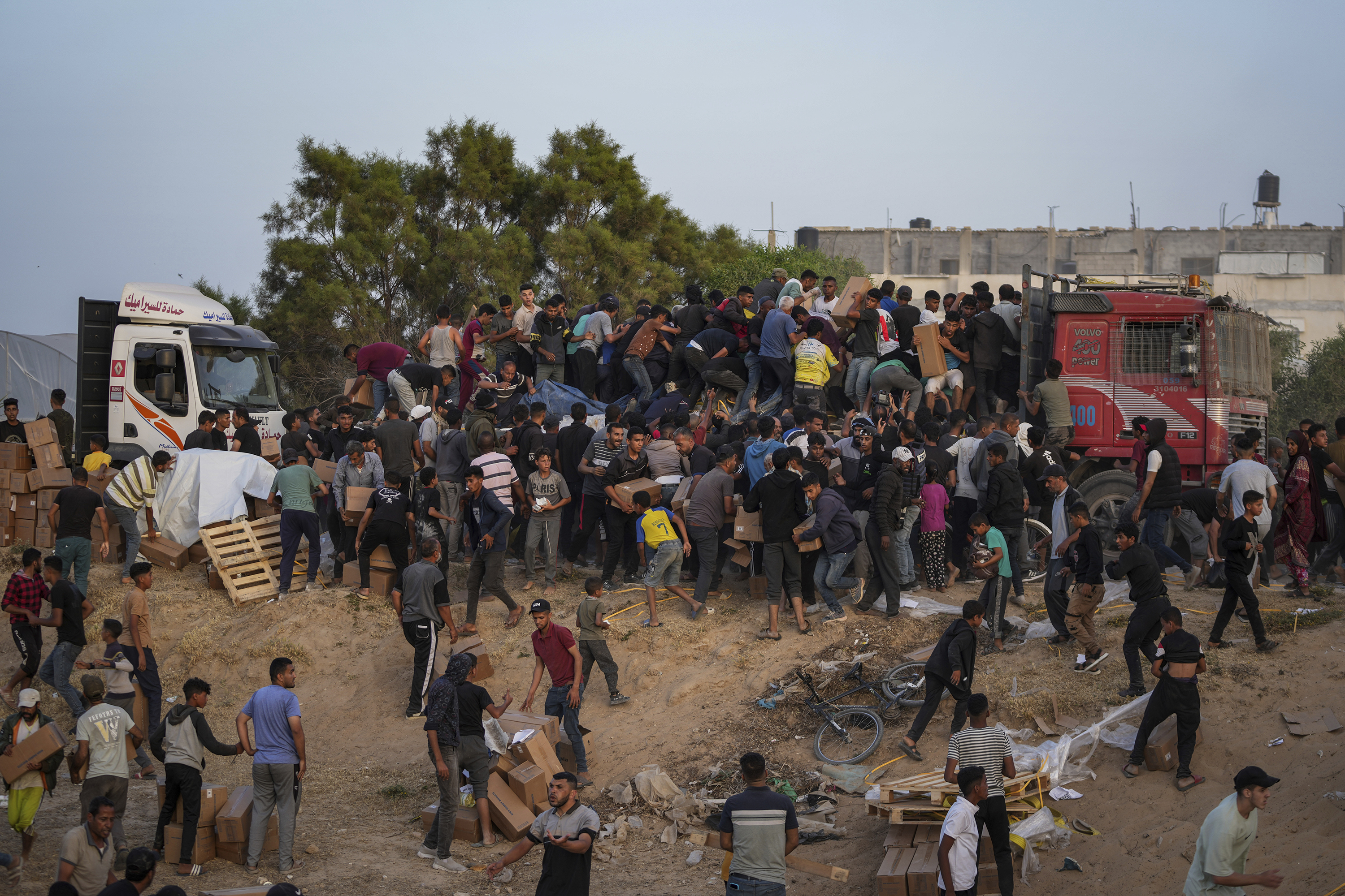 Palestinians are storming trucks loaded with humanitarian aid brought in through a new US-built pier, in the central Gaza Strip. Photo / AP