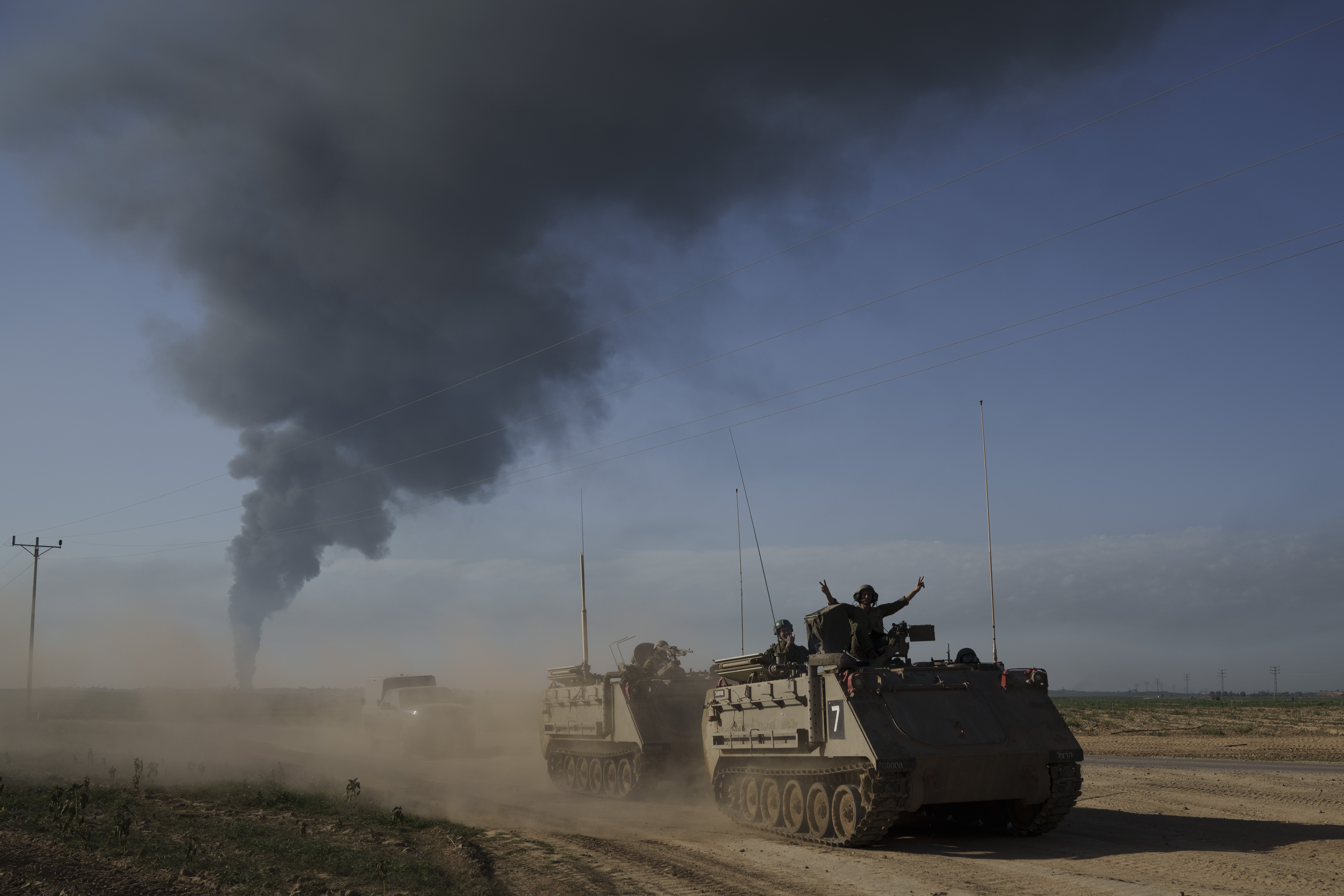 Israeli soldiers move on armoured personnel carriers (APC) near the Israeli-Gaza border on Sunday, January. 21, 2024. Photo / AP