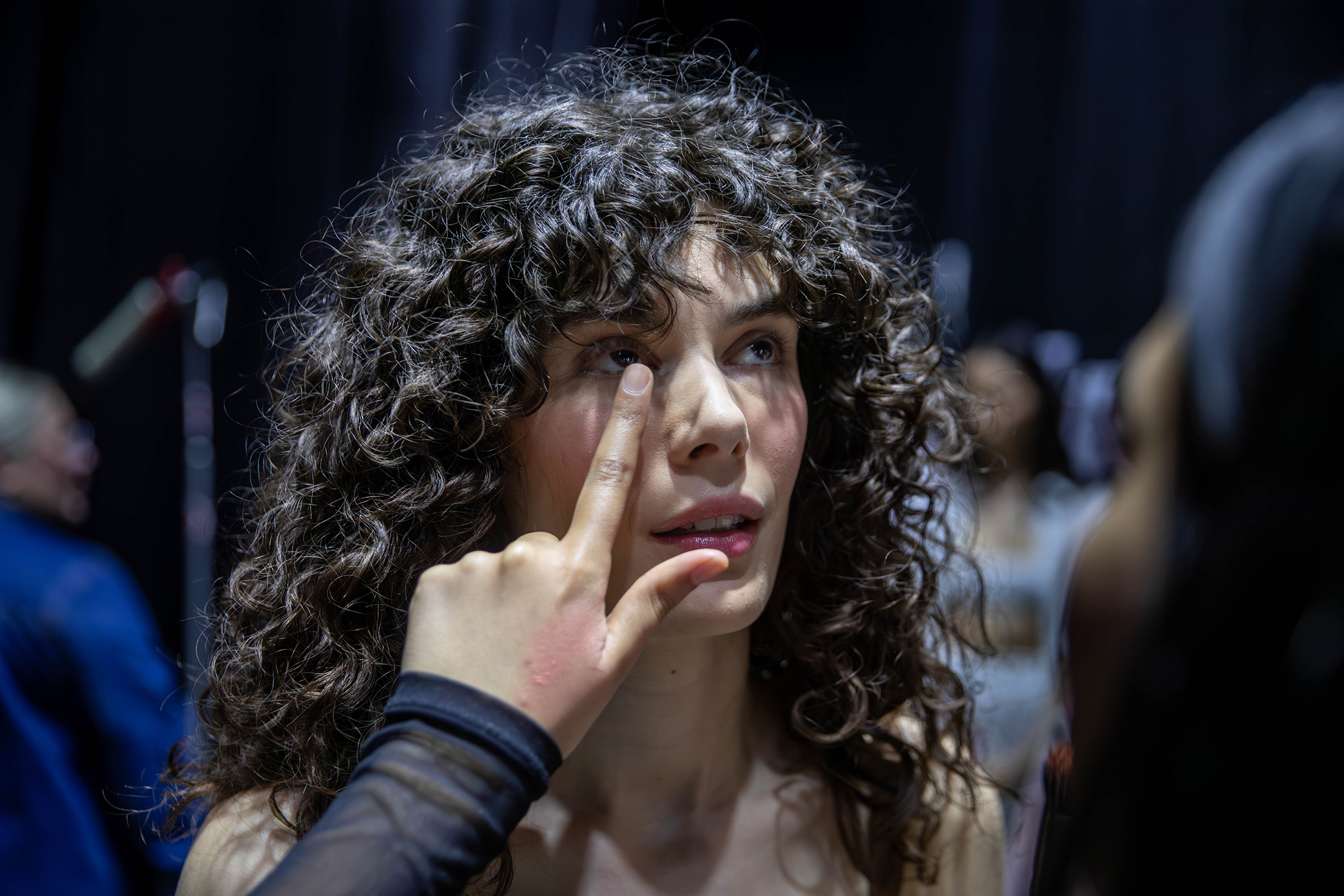 Final makeup adjustments for Hope Phillips, modelling for Juliette Hogan's 2023: Four collection at New Zealand Fashion Week: Kahuria. Photo / Michael Craig