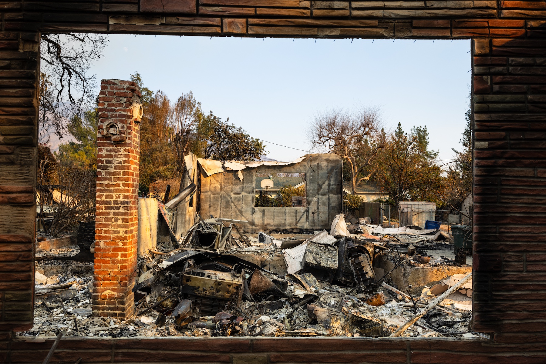Melted appliances are seen in the charred ruins of a house burned by the Eaton Fire in Altadena, California. Photo / AFP