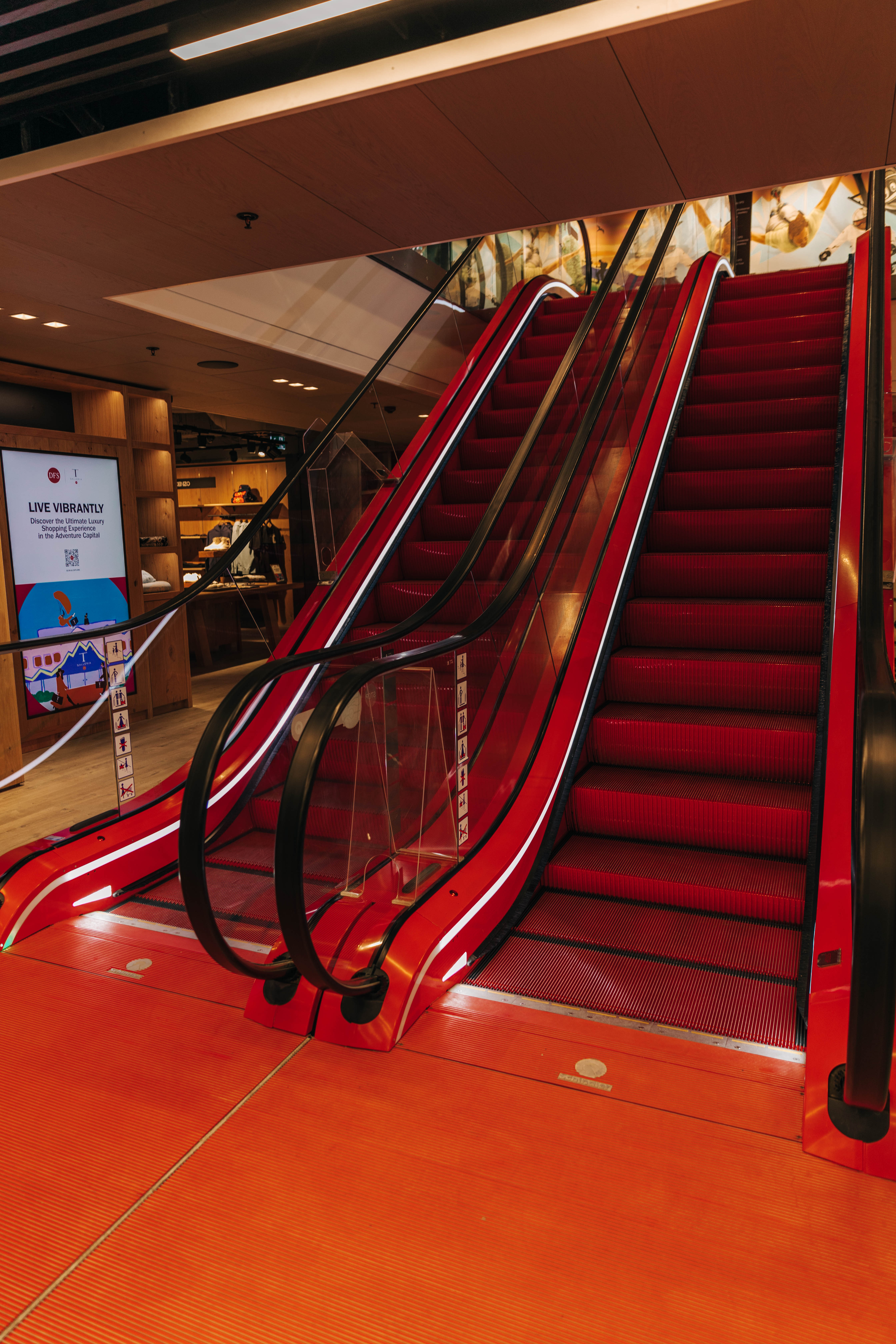 Eye-catching escalators in the signature DFS red. Photo / Isabella Rubie