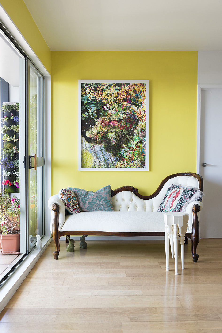 The artwork 'Silver Lining' by Deborah Crowe, against the wall in PPG’s Lady Lime, is a playful contrast to the ornately carved chaise. Photo / Cave Bureau