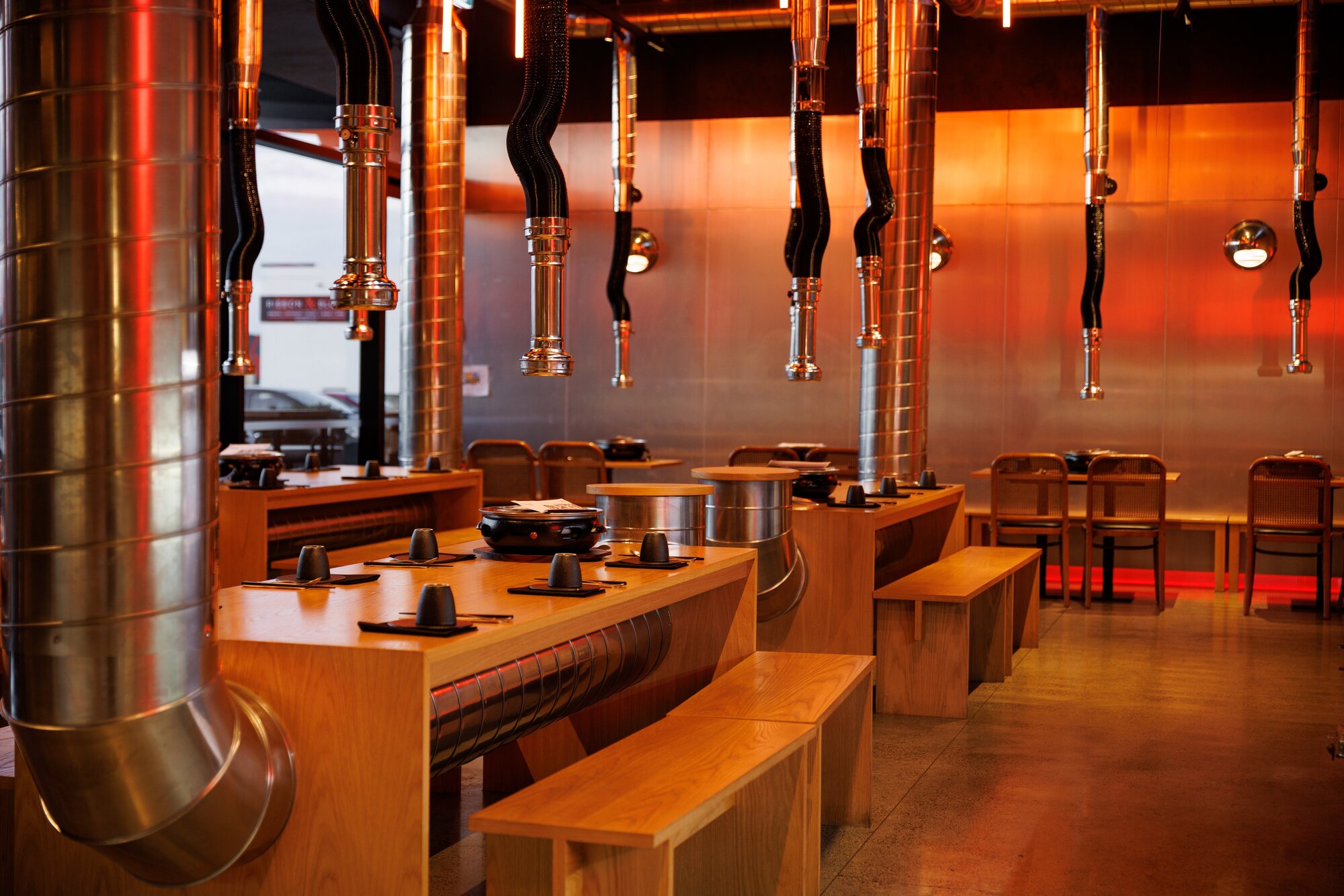 Individual extractor fan chimneys help clear the smoke from Korean BBQ at 1946 Butchery. Photo / Babiche Martens