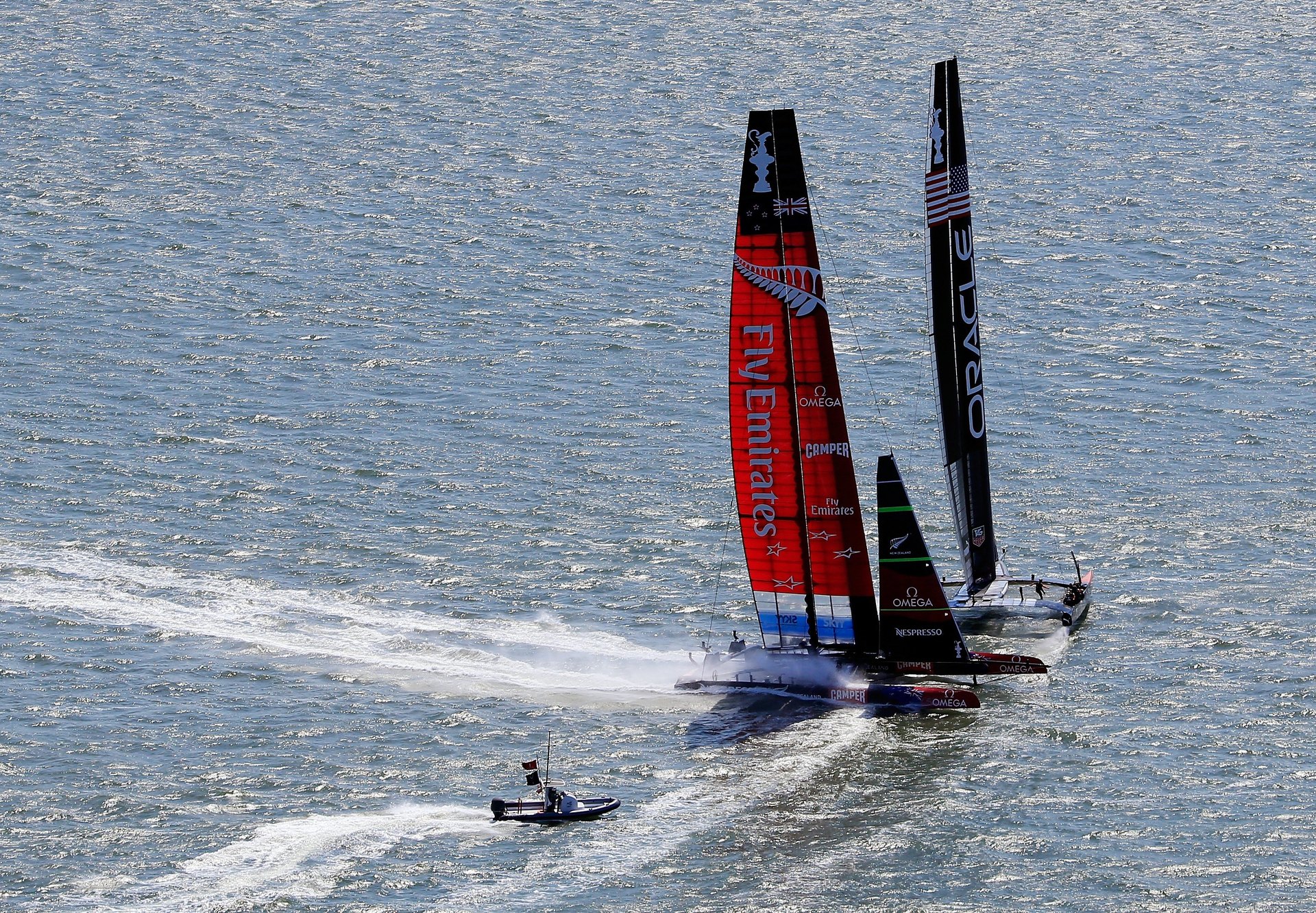 Emirates Team Zew Zealand and Oracle Team USA nearly collide as they cross paths during race 5 of the America's Cup Finals on September 10, 2013. Photo / Getty Images.