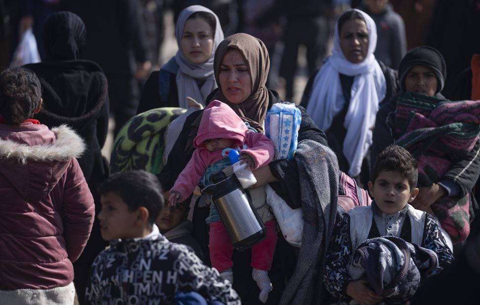 Palestinians arrive in the southern Gaza town of Rafah after fleeing an Israeli ground and air offensive in the nearby city of Khan Younis. Photo / AP